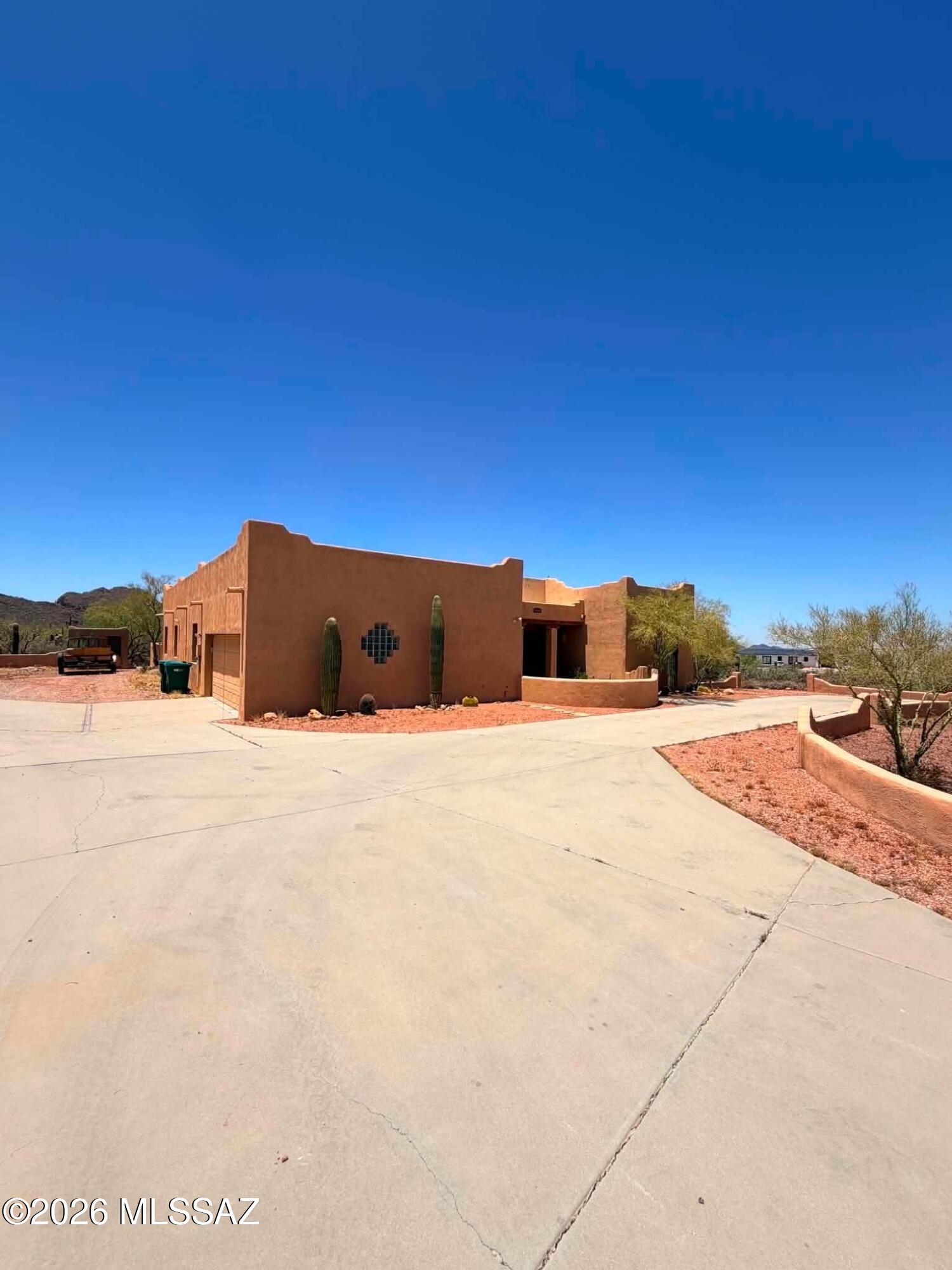 Stunning 4BR/3BA home tucked away on Tucson's desirable west side in a setting surrounded by natural desert beauty and incredible views. With 2857 sq. ft. of living space, this spacious home offers unique character and thoughtful upgrades throughout. Features include two fireplaces, exposed ceiling beams, skylights providing natural light, dual walk-in closets, and a beautifully appointed kitchen with ample cabinet and counter space. The open layout offers multiple living areas perfect for entertaining or relaxing. Step outside to a wonderful backyard designed for enjoying Tucson sunsets and hosting guests. Situated on a large lot with privacy and scenic surroundings, this home is a rare find. Call today to schedule your tour!
