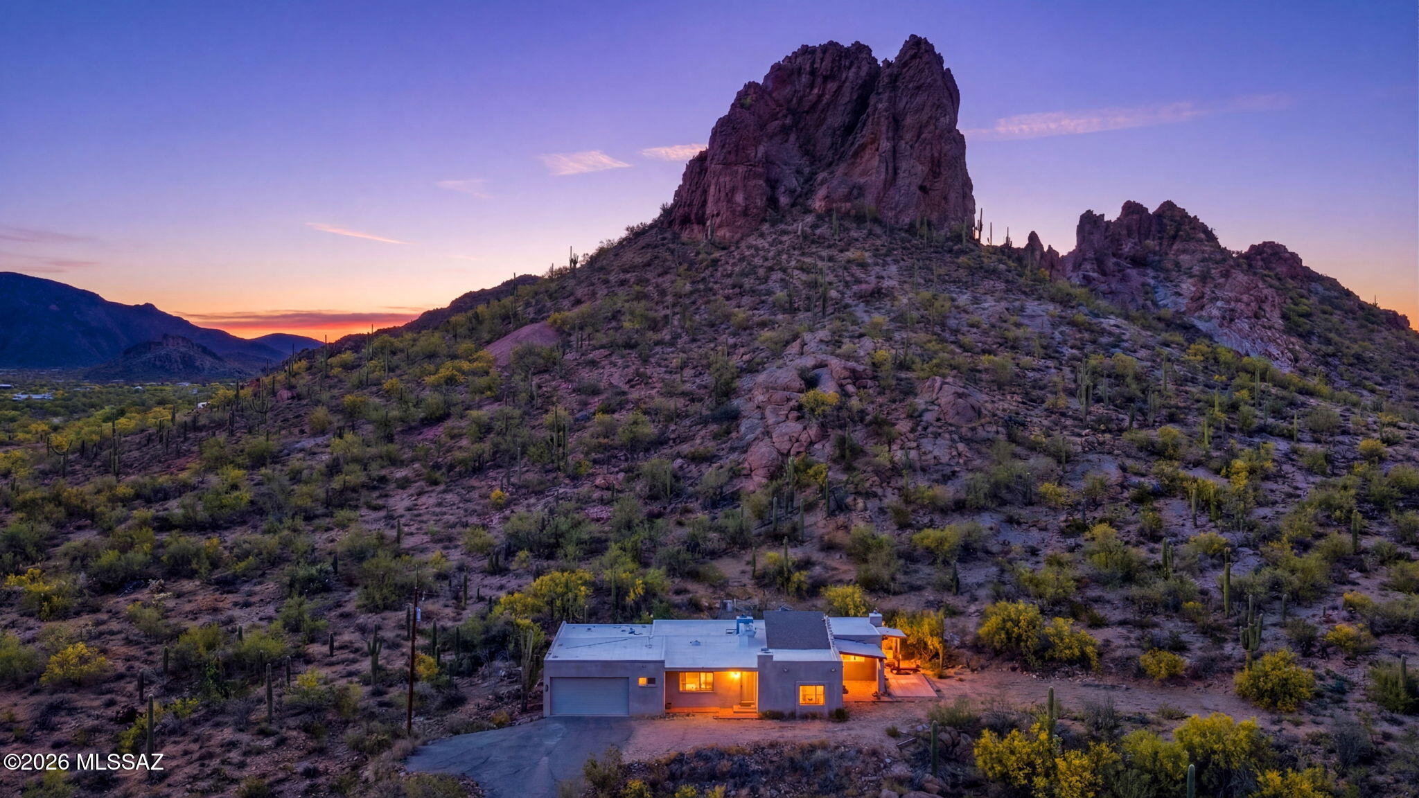 Sweeping city views, iconic Beehive Mountain directly out front, and 5 acres of pristine Sonoran Desert make this Southwest-style hillside home a rare Tucson find. Offering over 2,400 square feet with 3 bedrooms and 2.5 bathrooms, this property combines privacy, space, and timeless Southwestern charm in an unforgettable setting at the base of the mountains. Whether enjoying quiet desert mornings, colorful sunset skies, or entertaining against a stunning natural backdrop, this home delivers the lifestyle buyers dream about. 
I shaft (hole) behind the home that is fenced in there are no mine shafts are wells recorded that seller is aware of at this time