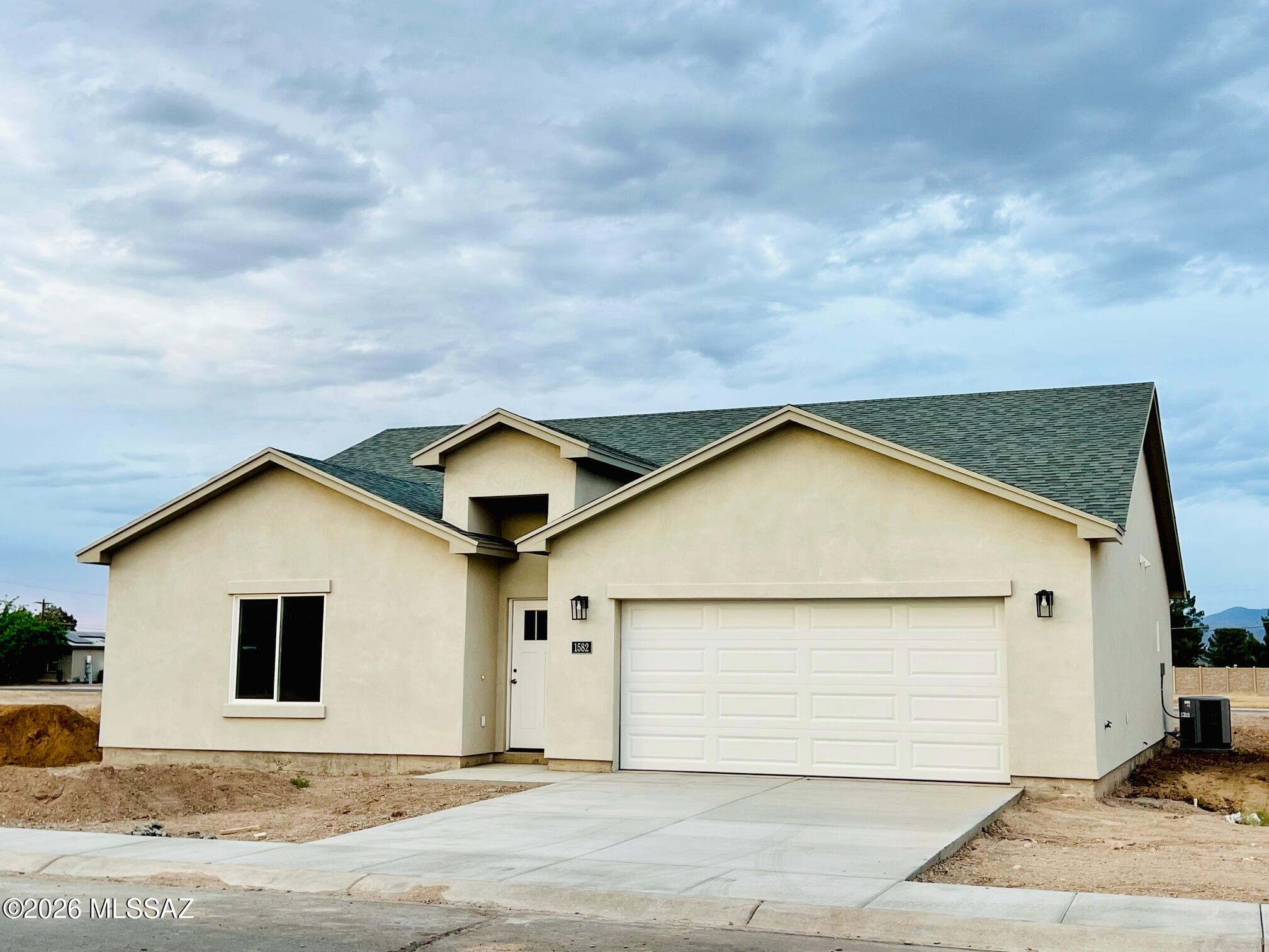 Don't miss out on this extra spacious new build located in the heart of Safford. You will love this new 3 bedroom 2 bath home with large, open living and dining areas. The master suite has a large bathroom with a tiled shower and soaking tub. You will enjoy living within walking distance to schools and shopping. A block wall will be added before closing. Call for an appointment today.