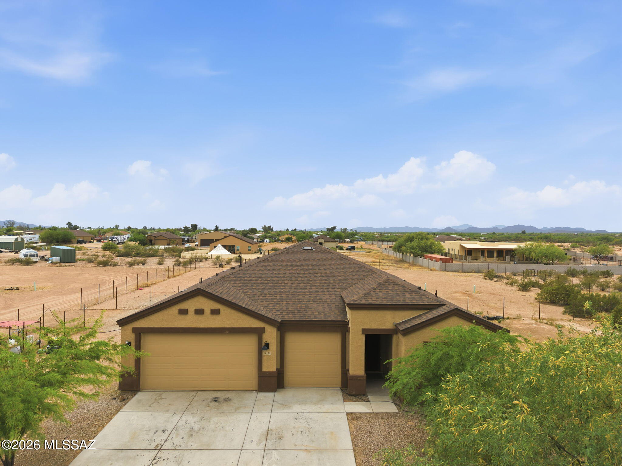 This beautiful 2023 DR Horton home is situated on a one-acre cul-de-sac lot with no HOA. The 4-bedroom, 3-full-bathroom split floor plan features an open kitchen equipped with a walk-in pantry, granite countertops, an island with barstool seating, and a breakfast nook.
The kitchen flows into the Great Room and a separate dining area. The spacious primary suite includes a large walk-in closet and a bathroom with a large shower and built-in storage shelves. The additional bedrooms are generously sized, and the laundry room provides extra storage. The interior features ceramic tile throughout with carpet in the bedrooms, and the property includes a 3-car garage. Residents can also enjoy beautiful views of the surrounding mountains. This is a must-see!