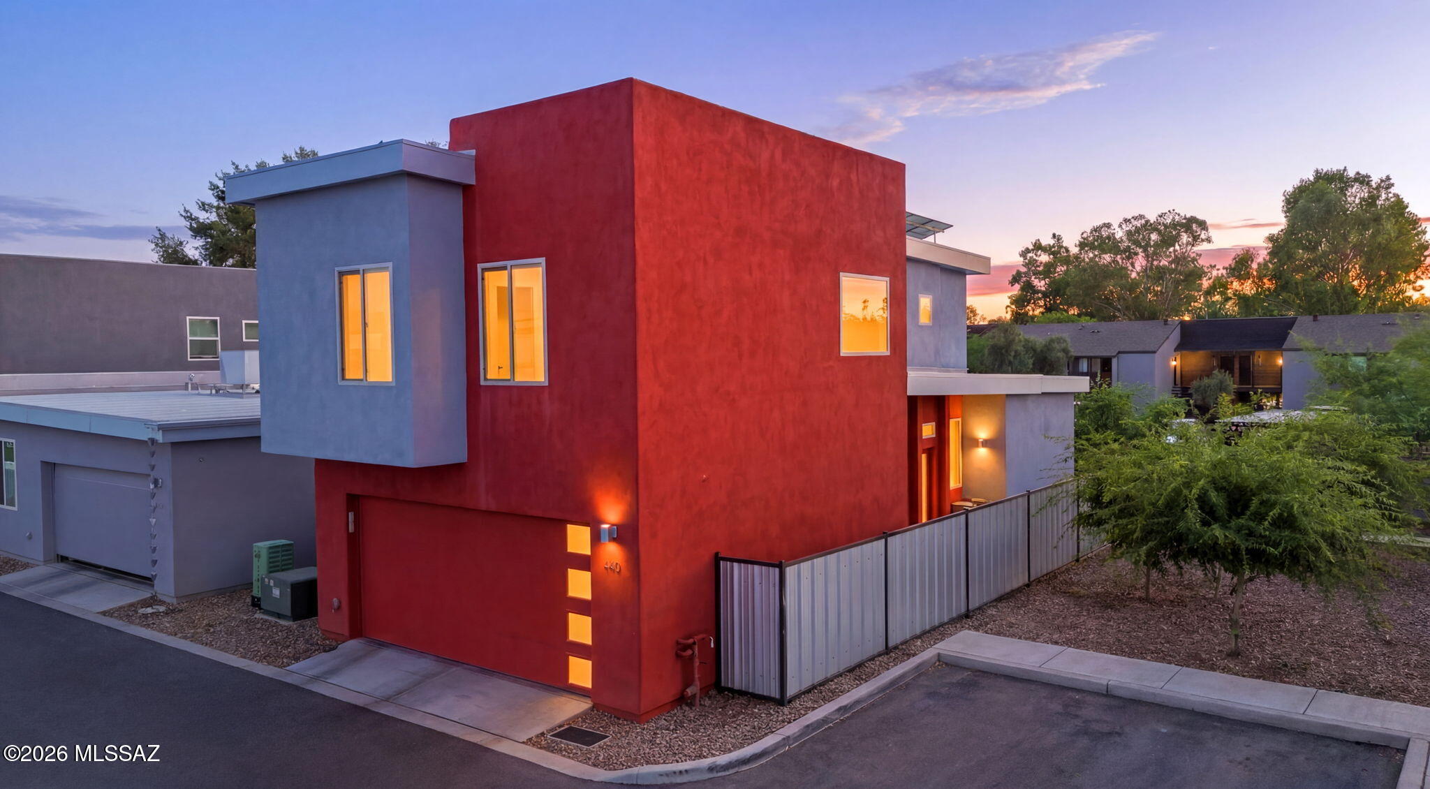 Some homes simply check the boxes. This one creates a feeling.
Rarely available within the community, this highly sought-after loft-style floorplan offers a level of architectural character that's difficult to find. Soaring ceilings and expansive windows flood the home with natural light, creating a bright, airy atmosphere that feels both open and inviting. With only one neighboring property, you'll enjoy an added sense of privacy that enhances the peaceful setting. At the same time conveniently located 
1.5 mi to the Tucson Loop , .5-mi to East Saguaro National Park, and 9-mi to the base of Mt Lemmon. Thoughtfully upgraded with over $40,000 in improvements, this home seamlessly blends modern style with everyday convenience. Owned solar and open cell foam insulation throughout helps keep energy costs down, while smart switches throughout bring effortless technology to your fingertips. The spacious two-car garage provides ample storage, making this home as functional as it is beautiful.

Every detail has been carefully curated, resulting in a home that stands apart from the ordinary. Whether you're enjoying quiet mornings in the sun-filled living spaces or entertaining beneath the dramatic vaulted ceilings, 440 S. Contempo delivers a lifestyle that's as distinctive as its design.

Rare. Refined. Move-in ready. This is one you simply have to experience in person