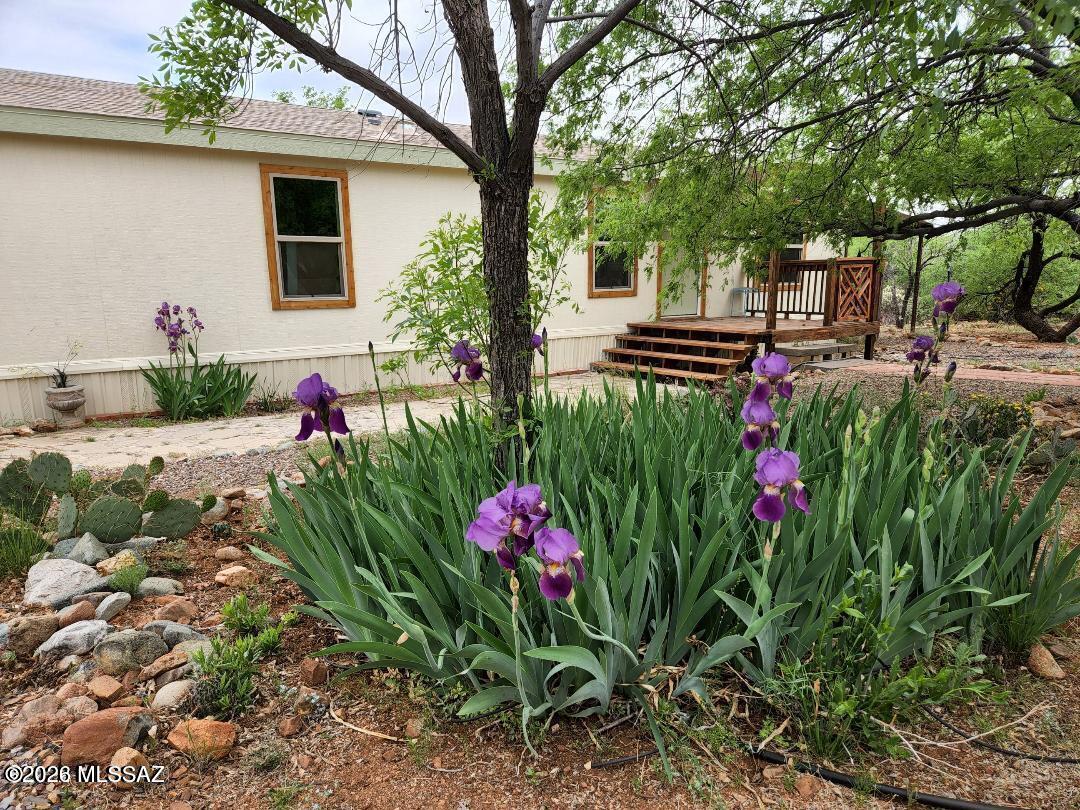 1 Acre NO HOA Views Upgrades! Must see! Affixed manufactured home on a fully usable lot in Catalina offering privacy, open space, and beautiful mountain views. Enjoy a peaceful setting at the end of the road with room for RVs, toys, or animals and no HOA. Property includes a workshop/shed and plenty of outdoor space to relax or entertain. Spacious interior layout with great natural light and flexible living areas. Kitchen w/Quartz countertops. Bright bathrooms featuring solar tube skylights for natural light. Conveniently located near shopping while still offering a quiet, rural feel. Financing eligible, making this a great opportunity for full-time living, seasonal use, or investment.