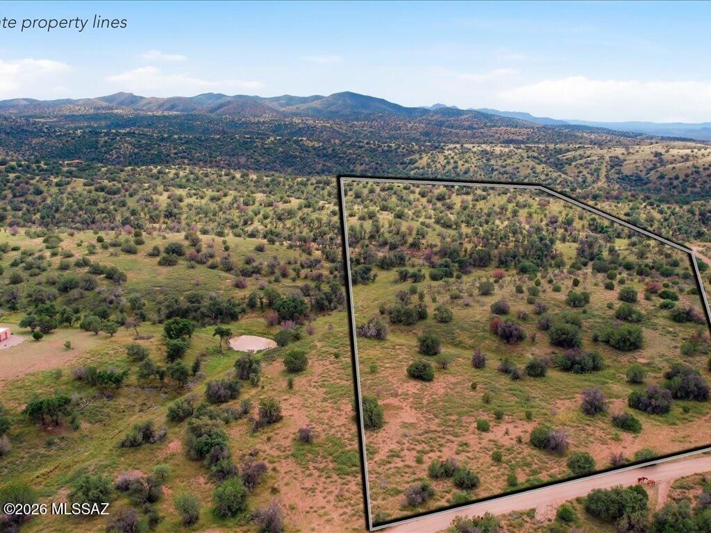 Fantastic mountain views from this rolling hilled property, plenty of large of trees cover the lot, equestrian ride out opportunity or hiking, multiple building sites to choose from. Welcome to Sonoita wine country close to the cross roads and forest service, this large parcel located in a gated community allows for Building your dream home, guest house and a barn on 42 plus acres. Power along property line.