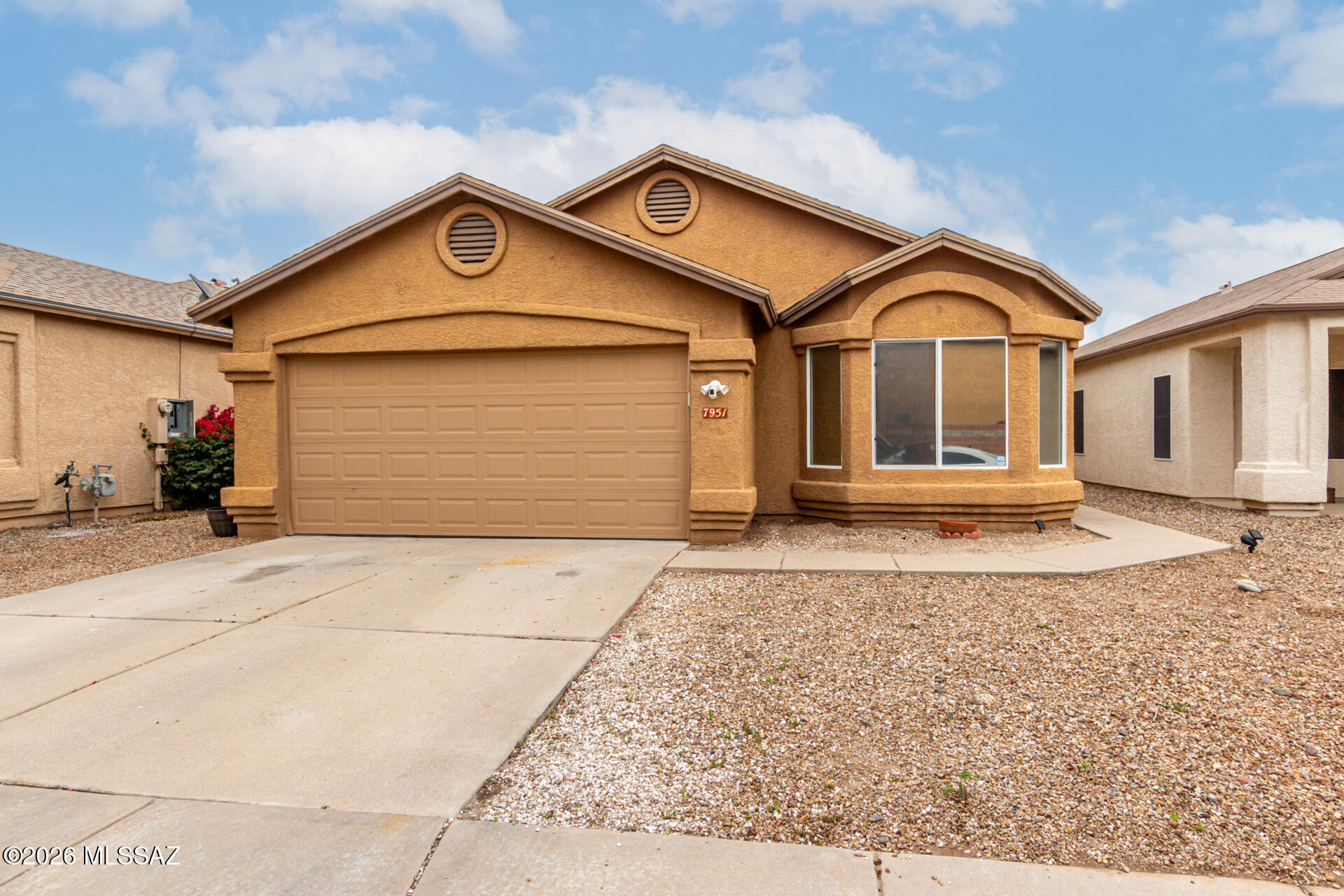 Welcome home in Silver Pass! This delightful 3-bedroom residence offers comfort & exceptional living spaces throughout. From the moment you arrive, you'll be greeted by a great curb appeal, easy-care desert landscaping, and a 2-car garage. Inside, discover a bright & spacious living room enhanced by soaring ceilings, soft gray paint, wood-look tile flooring, and a formal dining room. The kitchen features abundant cabinetry, ample counter space, built-in appliances, and a breakfast room. Enjoy the privacy the split primary suite offers, a walk-in closet and a full bathroom with dual sink, complete this retreat. The backyard oasis features a sparkling blue pool and multiple seating areas to sunbathe. Ideal starter home with all the must-haves! Don't miss the opportunity. Act now!