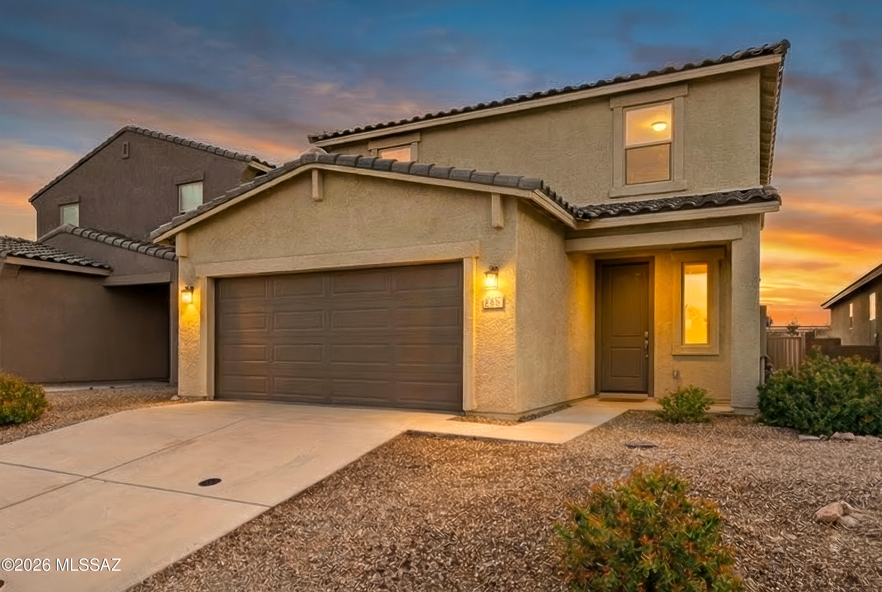 Welcome home, this beauty is the Revel Floorplan, a former model home featuring a spacious two-story design with 4 bedrooms, 3 bathrooms, a versatile loft, and a 2-car garage with an epoxy finish. The open-concept layout is highlighted by designer finishes throughout, including umber cabinetry, shaded gray granite countertops, wood-look tile flooring, and multi-tone carpet, all part of the curated Elemental interior package.

This move-in-ready residence includes washer, dryer, refrigerator, and whole-home blinds, offering immediate comfort and convenience. Ideally located near major employment centers such as Davis-Monthan Air Force Base and Tucson International Airport, with easy access to The Loop Bike Trail and a nearby community park.

Built with innovative energy-efficient featur , this home provides enhanced comfort, long-term savings, and peace of mind--perfectly suited for today's lifestyle.