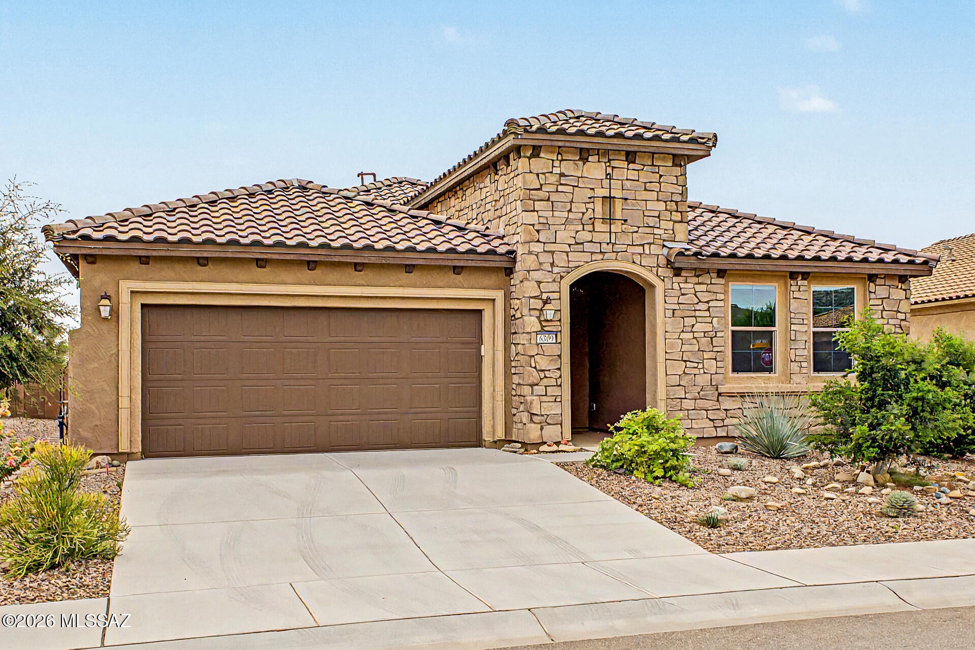 Almost new! Your ideal retirement in the highly coveted Del Webb @Dove Mountain (Amenities Galore)Age 55 & Up. Beautiful 2 beds + den, 2 bths, & a 2-car gar. House is loaded with all the upgrades. Stone accent facade & low-care landscape are just the beginning. The interior exudes elegance with high ceilings, tons of natural light, neutral palette, recessed lighting, tile flooring in common areas, & carpet in bedrooms. You'll love the seamlessly flowing open-concept floor plan! The impressive kitchen boasts high-end SS appliances, quartz counters, a walk-in pantry, espresso shaker cabinet w/crown molding, and a large island w/breakfast bar. French doors open to the versatile den, ideal for an office! The main bedrm has an ensuite with dual vanities, lavish tiled shower, & a walk-in closet. The laundry room is spacious and comes with built in cabinets and a sink.  Enjoy the spacious pantry with built in cabinets.  

You'll love the charming backyard, offering artificial turf, well-laid pavers, a putting green, and a cozy covered patio w/fireplace! 

PLUS! Community amenities include a spectacular clubhouse, resort-style pool & spa, pickleball & tennis courts, fitness center, Bocce ball, and billiards, offering plenty of opportunities for recreation, relaxation, and socializing. Don't miss this opportunity!

Priced to sell.  We beat the competition!