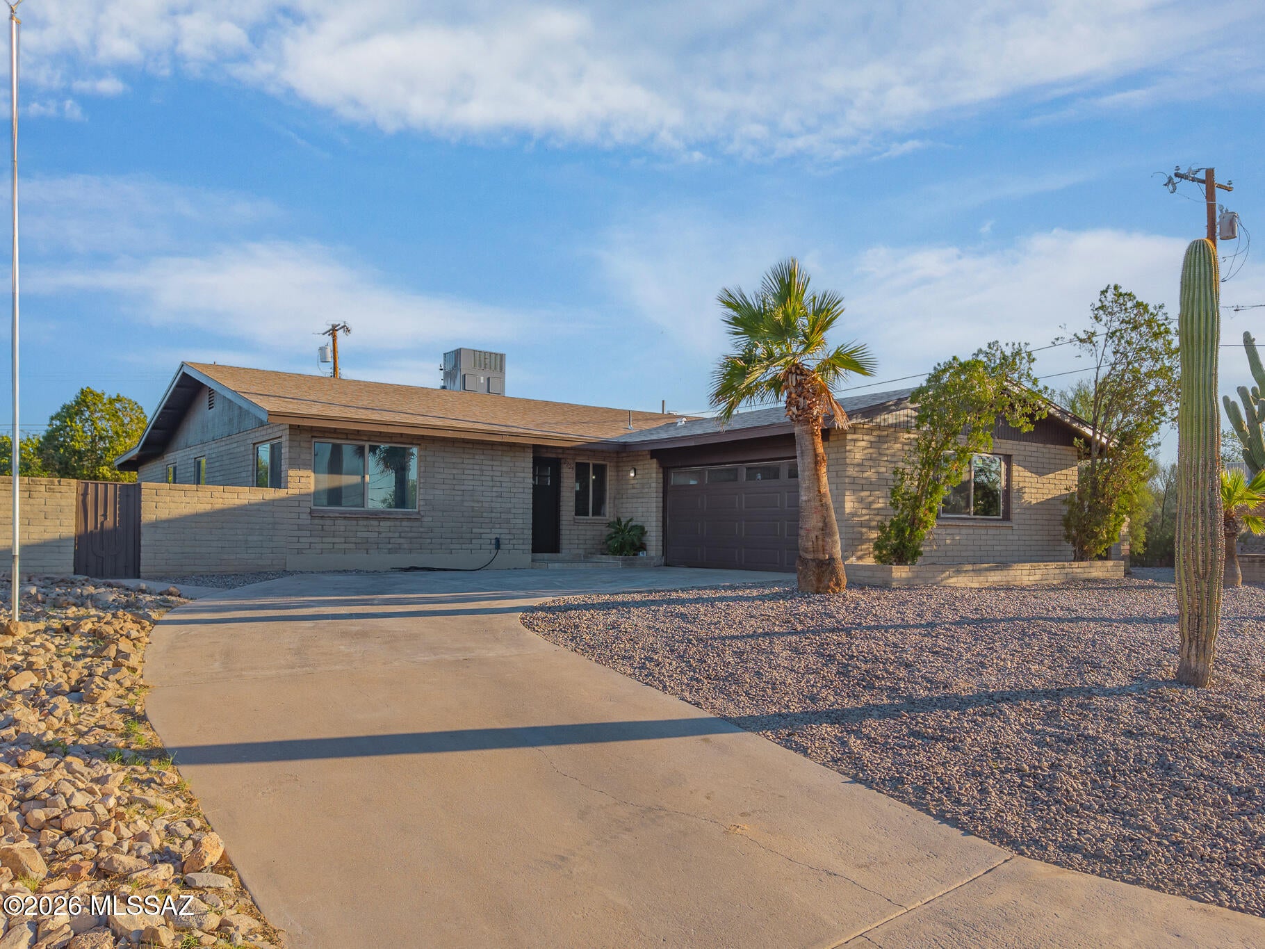 From the moment you arrive, it's clear this home is something special. Completely remodeled and thoughtfully redesigned, this 4-bedroom, 2-bath home offers 2,045 square feet of stylish, move-in-ready living. Major improvements include new roof shingles, a new HVAC system, renovated kitchen and bathrooms, new flooring throughout, updated finishes, and a freshly resurfaced pool. The open-concept layout flows effortlessly between spacious living areas and the modern kitchen, while abundant natural light creates a bright, inviting feel. Step outside to a private backyard with a covered patio, mature landscaping, and pool--ideal for relaxing or entertaining. Located in a desirable Tucson Westside neighborhood with convenient access to downtown, I-10, shopping, dining, and outdoor recreation.
