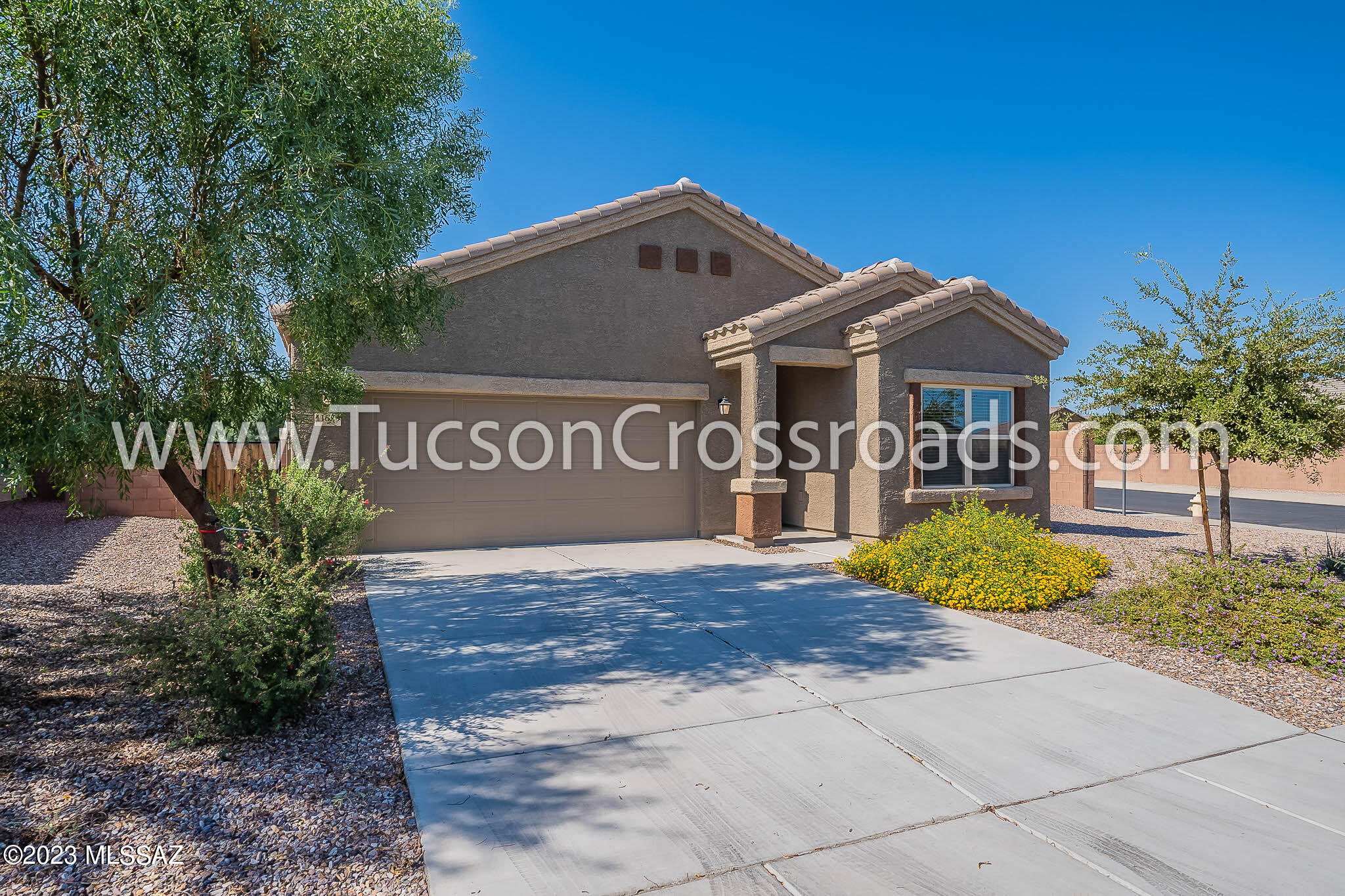 3 bedroom/2 bath home on corner lot. Tile flooring everywhere except for the bedrooms. Lots of cabinets and counter space in the kitchen with pantry closet, rich Espresso colored cabinets, granite counters & stainless-steel appliances including gas stove & side-by-side refrigerator. The primary bath has a walk-in shower, dual sinks & a generous walk-in closet. Ceiling fans in all the bedrooms and great room. Energy efficient on-demand water heater. Covered patio with large easy-care backyard. Do you have an electric vehicle? There is an EV charging outlet in the garage! Washer & dryer included. 1-year minimum lease. Non-smoking home. $45 application fee per adult. Subject to credit approval. Renters insurance required. Call listing agent for additional details & leasing information.