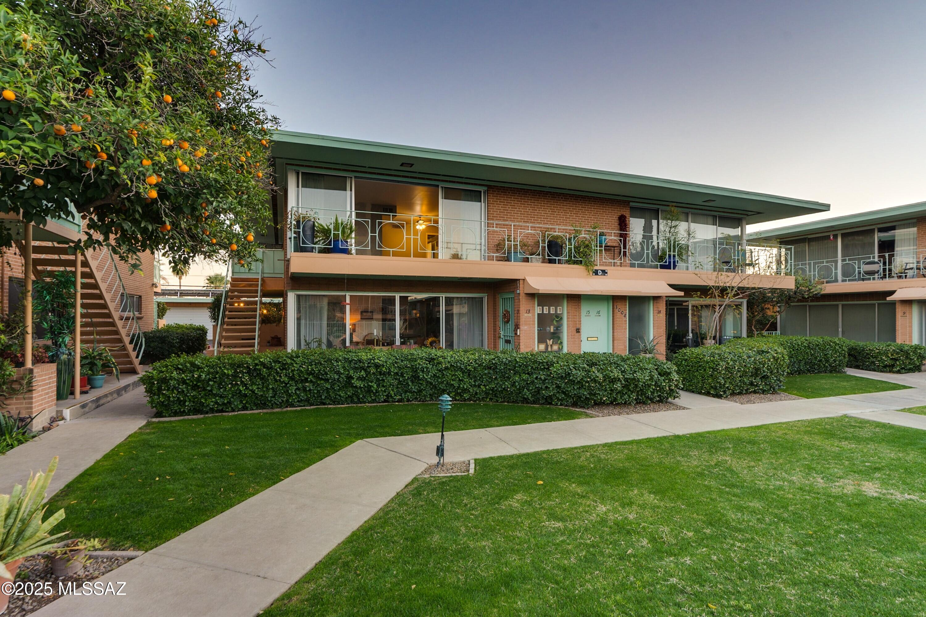 Designed by renowned architect Lionel Mayell, Villa Catalina embodies the post-war garden apartment concept, blending timeless elegance with modern convenience. Listed on the National Register of Historic Places, a Tucson landmark, known for its expansive windows, inviting patios, and beautifully maintained grounds. This Mid-Century Modern 55+ community is in the desirable Historic Sam Hughes corridor. This second-story residence boasts one of the best locations in the complex, offering breathtaking panoramic views of the Catalina Mountains and the lush, mature landscaping below. Step inside to find a bright and stylish living space, where a wall of floor-to-ceiling windows floods the room with natural light and seamlessly connects indoor and outdoor living. Recent flooring, fresh paint and move-in ready. The remodeled bathroom boasts an attractive marble dual vanity, tiled floors, a walk-in fully tile shower and already prepped for stacked washer and dryer!! The spacious primary bedroom features a private patio and a cedar closet.
Residents enjoy an array of amenities, including two swimming pools, shuffleboard courts, a putting green, built-in barbeques, and meticulously landscaped gardens. The comprehensive HOA package covers a shared two-car garage, utilities (electric & water), property taxes, insurance, HVAC & water heater maintenance, roof upkeep, valet trash service, and groundskeeping offering a truly hassle-free lifestyle.
Don't miss your chance to experience the charm and convenience of this one-of-a-kind community. Visit Villa Catalina to learn more about this historic Tucson gem!
