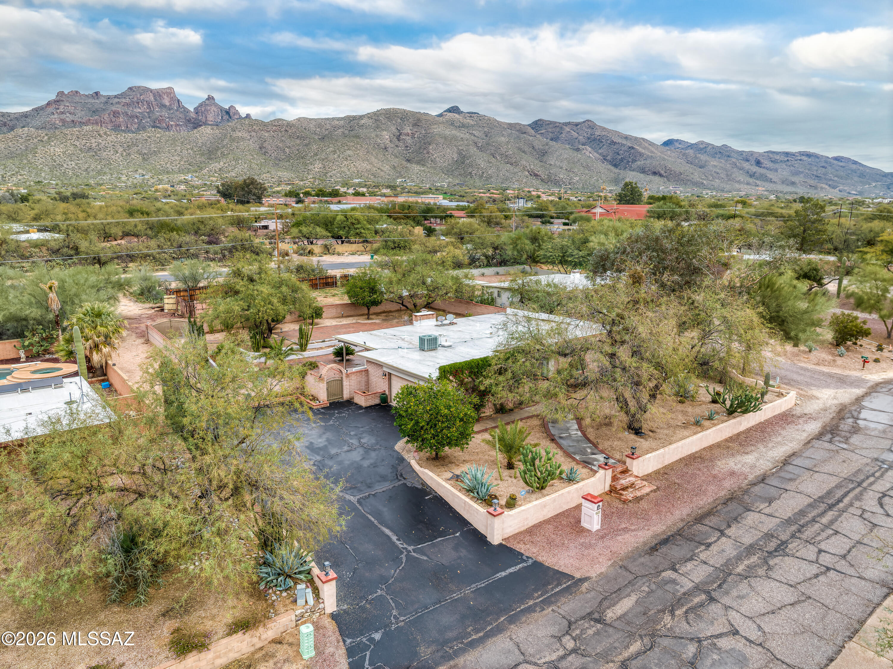 Tucked away on a quiet cul-de-sac in Tucson's desirable northeast corridor, this spacious 1,974 square foot residence offers a rare combination of thoughtful updates, functional design, and inviting indoor and outdoor living. Set on a generously sized lot, the home provides both privacy and room to breathe in an established neighborhood known for its peaceful setting and convenient access to everyday amenities. The interior showcases a well-designed floor plan featuring four bedrooms and two full bathrooms, offering flexibility for a variety of living arrangements. Upon entering, you are greeted by expansive living areas filled with natural light, creating a warm and welcoming atmosphere ideal for both daily living and entertaining.