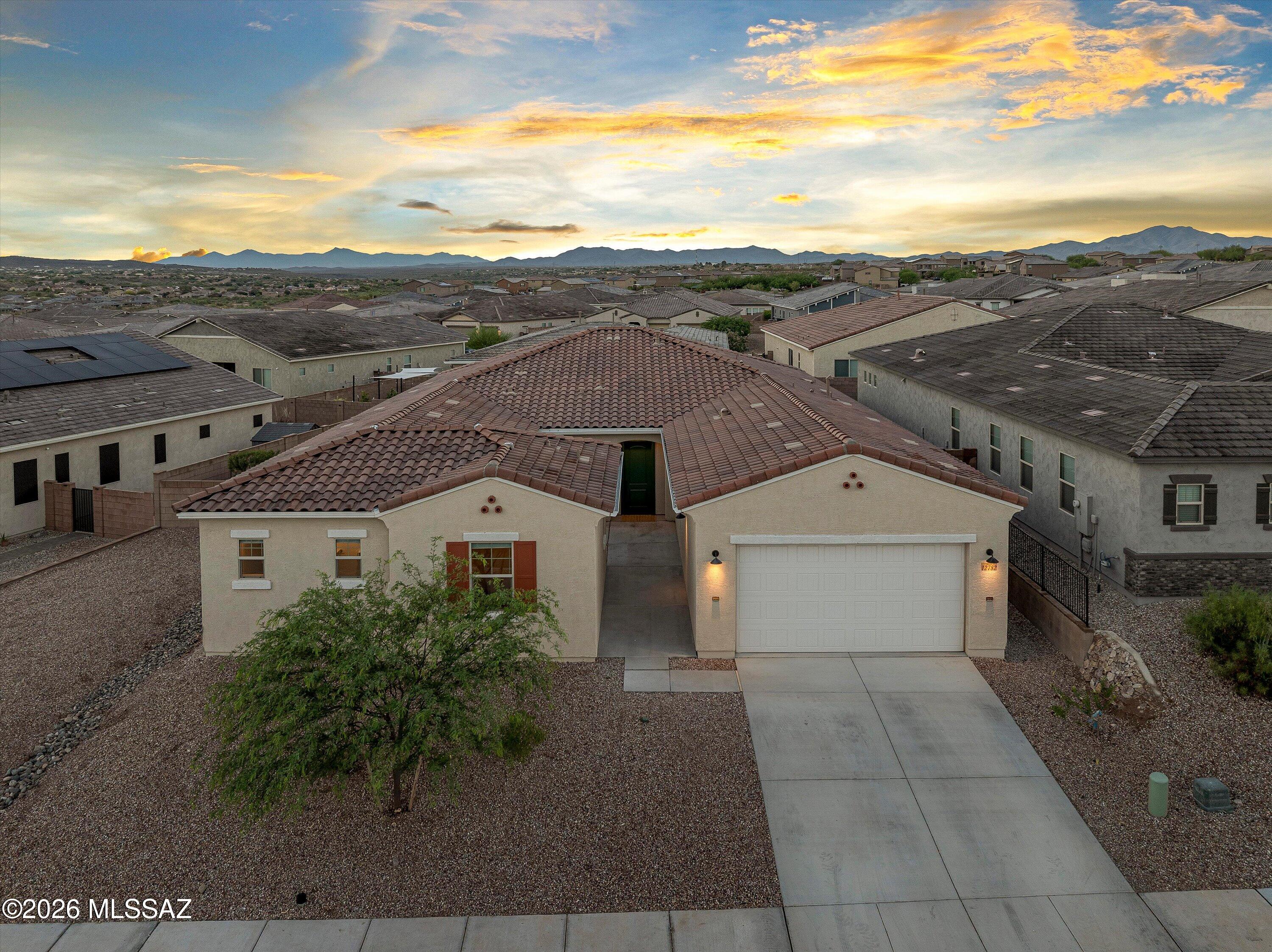 Built in 2024, this 3,229 sqft Mint floor plan features 4 bedrooms, including one with a private en-suite bath, along with 3.5 baths, a study, and bonus room. Inside, you'll find 10-foot ceilings, 8-foot doors, and a gourmet kitchen featuring an oversized island, large gas cooktop with vent hood, quartz counters and large walk-in pantry. The flexible layout provides room for work, guests, and everyday living, while the open-concept living areas offer plenty of space to gather and entertain. A 3-car garage provides ample storage and parking. Located directly across from the neighborhood park and within the Vail School District, this home combines the benefits of recent construction with a functional floor plan in a convenient location.