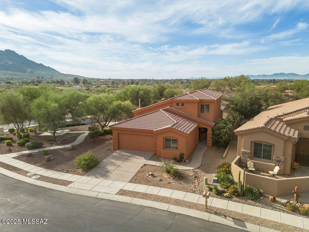 Spacious and versatile living in desirable Oro Valley! 203 E Brearley Drive offers the flexible floor plan today's buyers are looking for--perfect for multigenerational living, remote work, wellness space, or a home-based business. With generous interior square footage and multiple rooms that can adapt to your needs, this home is ideal for those needing private office space, guest quarters, a workout room, hobby area, or room for extended family.  Whether you have aging parents moving in, adult children needing space, or simply want extra rooms that work for your lifestyle, this home offers endless possibilities. The low-maintenance backyard is perfect for buyers who prefer easy upkeep and more time to enjoy nearby parks, golf, shopping, dining, and all that Oro Valley has to offer.