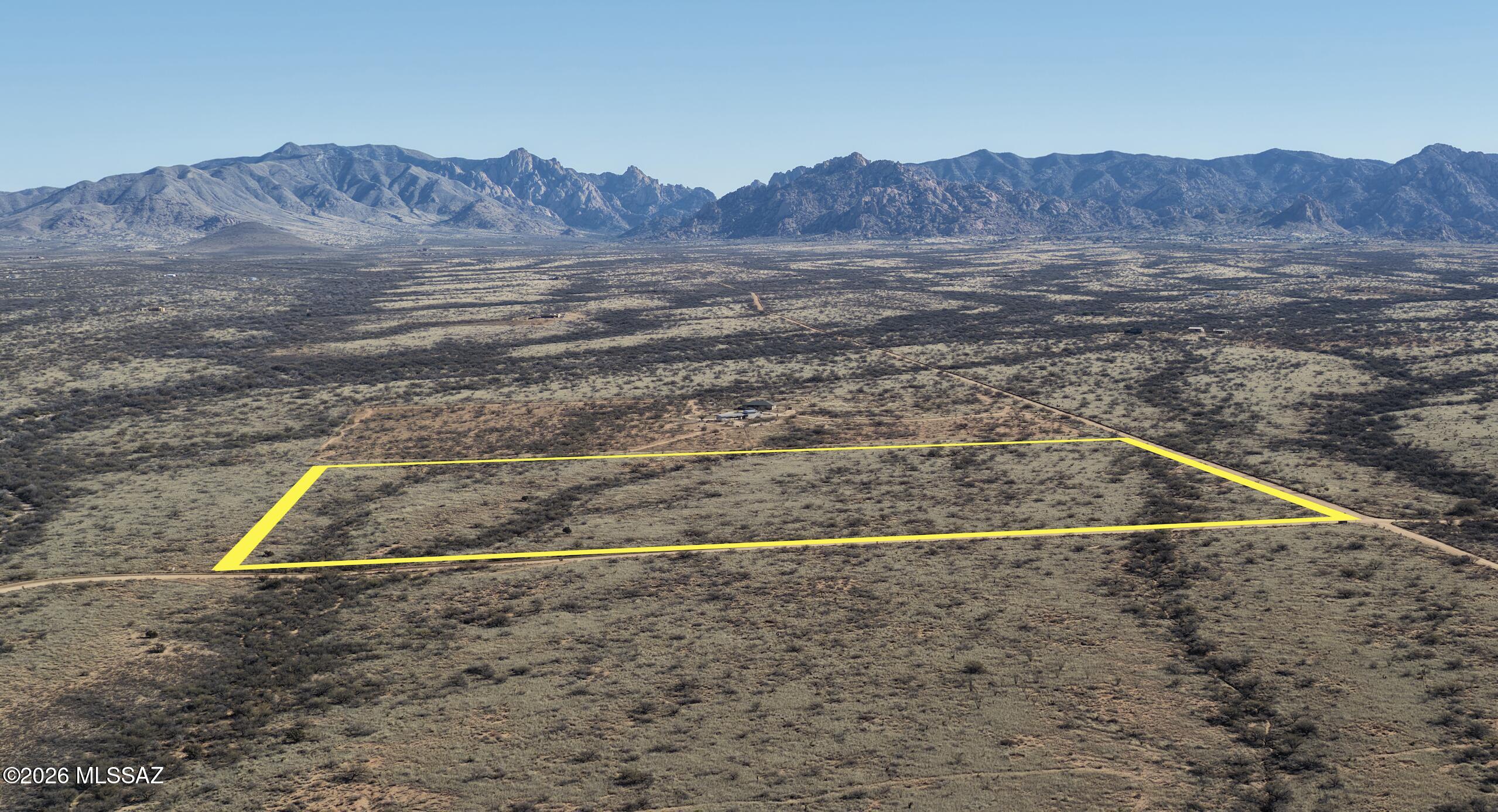 Discover the freedom of Arizona living with this 36-acre lot in Dragoon Mountain Ranch. Backing onto a protected conservation area, this property offers unmatched privacy and direct access to nature. Enjoy panoramic views of Cochise Stronghold, a destination for world-class hiking, rock climbing, and exploring rugged mountain trails. Perfect for those seeking a rural lifestyle, the ranch community allows horses, making it ideal for equestrian enthusiasts or anyone dreaming of wide-open space. Build your custom home or retreat surrounded by rolling hills, endless skies, and the tranquility of the Cochise Stronghold . With nearby access to Benson, Tombstone, and Tucson, you'll have convenience without sacrificing seclusion. Claim your piece of paradise today—schedule a visit today.