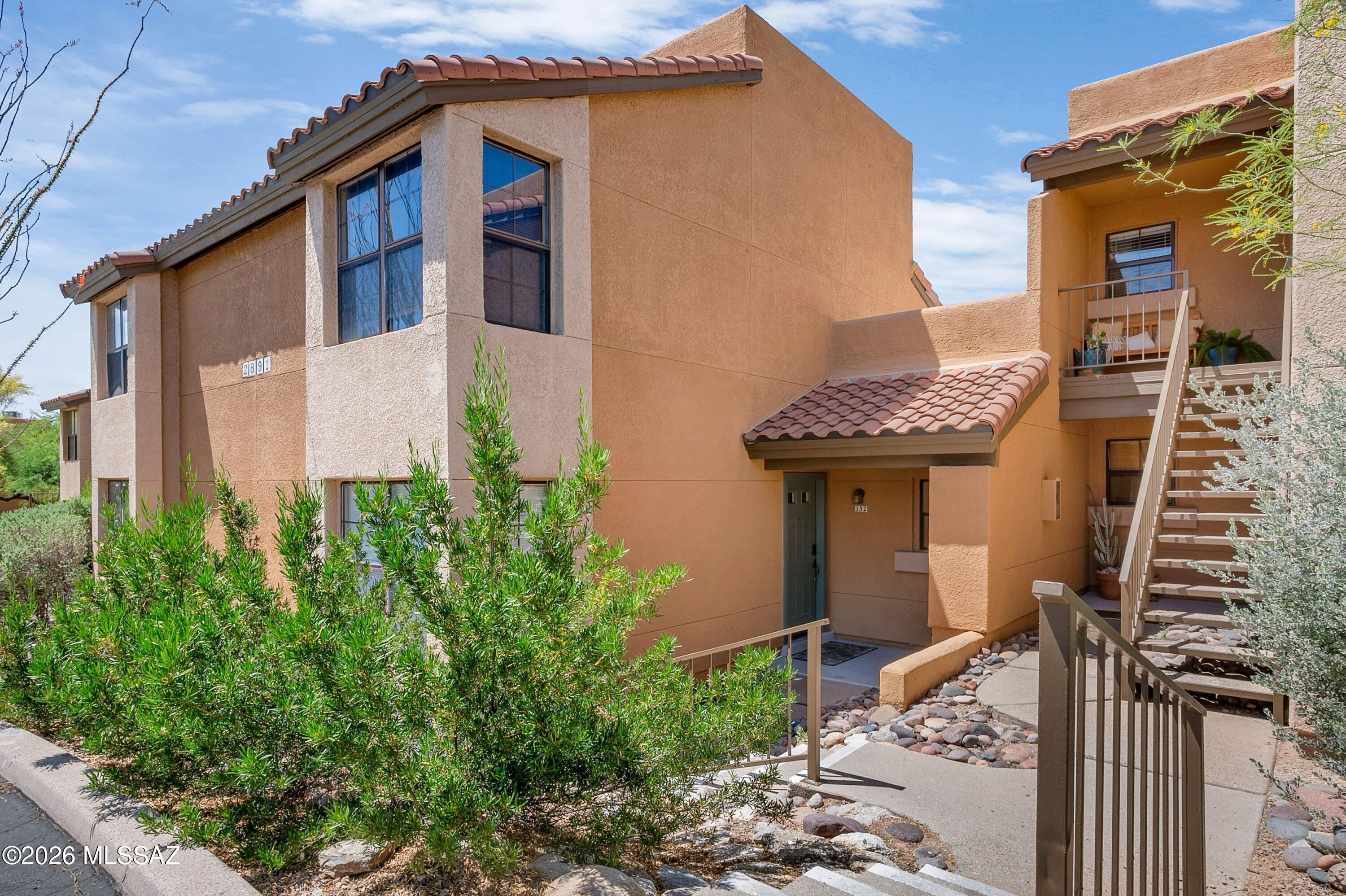 Perched in the highly sought-after Catalina Foothills of Tucson, this exceptional turn-key condo offers a rare blend of refined comfort, effortless living, and breathtaking natural surroundings at the base of the iconic Catalina Mountains. Ideally positioned near the top of Campbell Avenue and just moments from the upscale shopping and dining of La Encantada, this beautifully remodeled two-story residence delivers both convenience and tranquility in one of Tucson's most desirable locations. Offered fully furnished--with nearly new, thoughtfully selected pieces available on a separate bill of sale--this residence is truly move-in ready, making it an ideal primary home, seasonal retreat, or investment opportunity. From the moment you step inside, you'll be welcomed by soaring vaulted ceiling & expansive windows, and an abundance of natural light that enhances the home's open and airy feel. Stylish hard surface flooring flows seamlessly throughout, featuring a combination of luxury vinyl plank and ceramic tile--offering both durability and modern appeal with no carpet anywhere in the home. The updated kitchen serves as a central gathering point, showcasing elegant granite countertops, stainless steel appliances, ample cabinetry, and a functional layout that opens effortlessly to the main living spaces--perfect for entertaining or everyday living. The inviting living room is anchored by a cozy fireplace, creating a warm and welcoming ambiance, while large sliding doors lead you to a private covered patio designed for enjoying Arizona's stunning desert beauty. Step outside to your secluded outdoor retreat, where natural desert landscaping provides a peaceful buffer and enhances privacy. Here, you'll enjoy captivating mountain views and serene surroundings--ideal for morning coffee, evening relaxation, or entertaining under the Arizona sky. Upstairs, the spacious primary suite offers a true sanctuary, complete with custom built-in closet storage, a well-appointed en suite bathroom, and a tranquil atmosphere that complements the home's overall sense of retreat. Every detail throughout the home has been carefully curated to provide comfort, style, and functionality. Residents of this desirable foothills community enjoy access to resort-style amenities, including a heated pool and spa, tennis courts, a fitness center, clubhouse, BBQ areas, and meticulously maintained grounds--creating an elevated lifestyle experience right outside your door. Combining location, quality upgrades, and true turn-key convenience, this Catalina Foothills gem presents an exceptional opportunity to own a low-maintenance home in one of Tucson's most scenic and prestigious settings. Schedule your private showing today and experience the lifestyle this remarkable property has to offer.