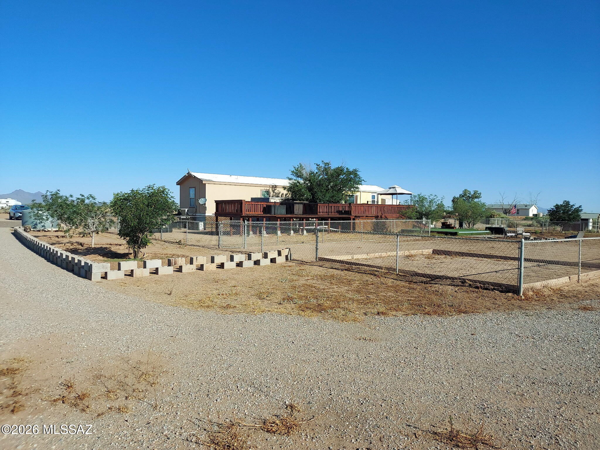 Investor Dream!! Private Registered Well with 3 electric pedestal, 3 septic tanks already installed, and RV hook ups NOTE: Seller is willing sell 20 acres separately of flat usable land for $199,000, which is subdividable. The 20 acres has electric, septic, water, and ready for your new home.  Please contact Listing Agent. Imagine owning your own Ranch or Homestead. This expansive 40 subdividable flat usable acreage has it all with panoramic mountain views and stunning sunrises and sunsets.  Ideal for animal lovers, hobby ranchers or anyone wanting to build the dream home/ranch. The home offers 3 bedrooms, 2 full bathrooms, and a sunroom with its own ice maker overlooking the natural landscape. The open living area features a modern electric fireplace, adding warmth and ambiance. The spacious primary suite includes a soaking tub and separate shower.  Buyer to verify all information.