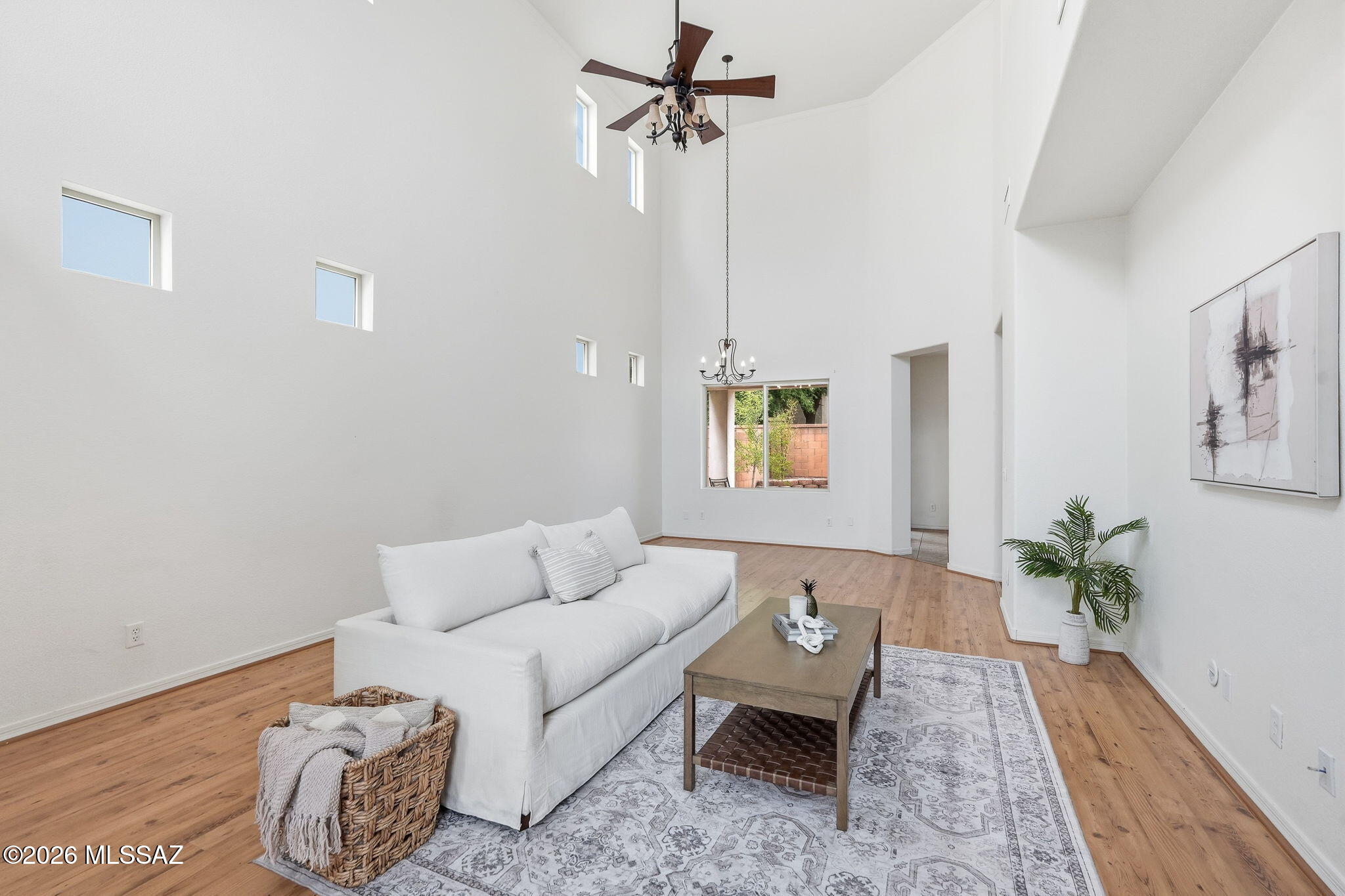 Assumable VA loan available! Ask your agent for details on this rare opportunity. Step inside to soaring high ceilings and bright, open living space. Set in Rancho Sahuarita, one of the Southern Arizona's most amenity-rich communities: resort-style pools, a splash park, fitness center, sport courts, and miles of trails around a stocked lake with its own lakeside amphitheater. Minutes to Green Valley golf courses, shopping, and dining, with Tucson International Airport and Raytheon's major Tucson campus just a 25-minute commute via I-19. Leased solar keeps energy bills low in the Arizona sun.