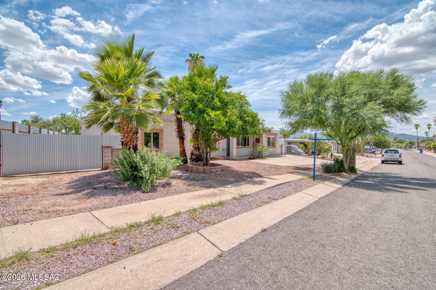 **NO HOA!!! MOUNTAIN VIEWS, MODERN UPDATES & ROOM TO LIVE!** This beautifully refreshed 3-bedroom, 2-bath home offers the rare combination of move-in-ready style, flexible living space, and a spacious backyard with endless possibilities. From the moment you arrive, you'll notice the mountain views that create a stunning Tucson backdrop from the front of the home. Inside, an extensively remodeled kitchen provides a fresh, modern heart of the home, while new vinyl flooring and carpet create a clean, cohesive feel throughout. The versatile den--with its inviting wood-burning fireplace--can become your home office, cozy retreat, hobby room, or second living space. **With the appropriate modifications, the den may offer the potential to function as a fourth bedroom- *see additional description NO HOA!!! MOUNTAIN VIEWS, MODERN UPDATES & ROOM TO LIVE! This beautifully refreshed 3-bedroom, 2-bath home offers the rare combination of move-in-ready style, flexible living space, and a spacious backyard with endless possibilities. From the moment you arrive, you'll notice the mountain views that create a stunning Tucson backdrop from the front of the home. Inside, an extensively remodeled kitchen provides a fresh, modern heart of the home, while new vinyl flooring and carpet create a clean, cohesive feel throughout. The versatile den--with its inviting wood-burning fireplace--can become your home office, cozy retreat, hobby room, or second living space. With the appropriate modifications, the den may offer the potential to function as a fourth bedroom-- giving buyers valuable flexibility for changing needs. A separate laundry room adds everyday convenience, and a newer A/C system helps keep the home comfortable through Tucson's warm seasons. Step outside to enjoy the covered patio, new metal fencing, and generous backyard--a true blank canvas ready for entertaining, gardening, play, or creating your own private outdoor retreat. The side gates opens up fully to allow for boat or RV parking. With approximately 1,518 sq. ft. of living space, three bedrooms, two full baths, and thoughtful updates throughout, this Casas Adobes Park home delivers the comfort and flexibility today's buyers are looking for. Come see the mountain views, the updates, and the possibilities for yourself--this is one you'll want to experience in person!