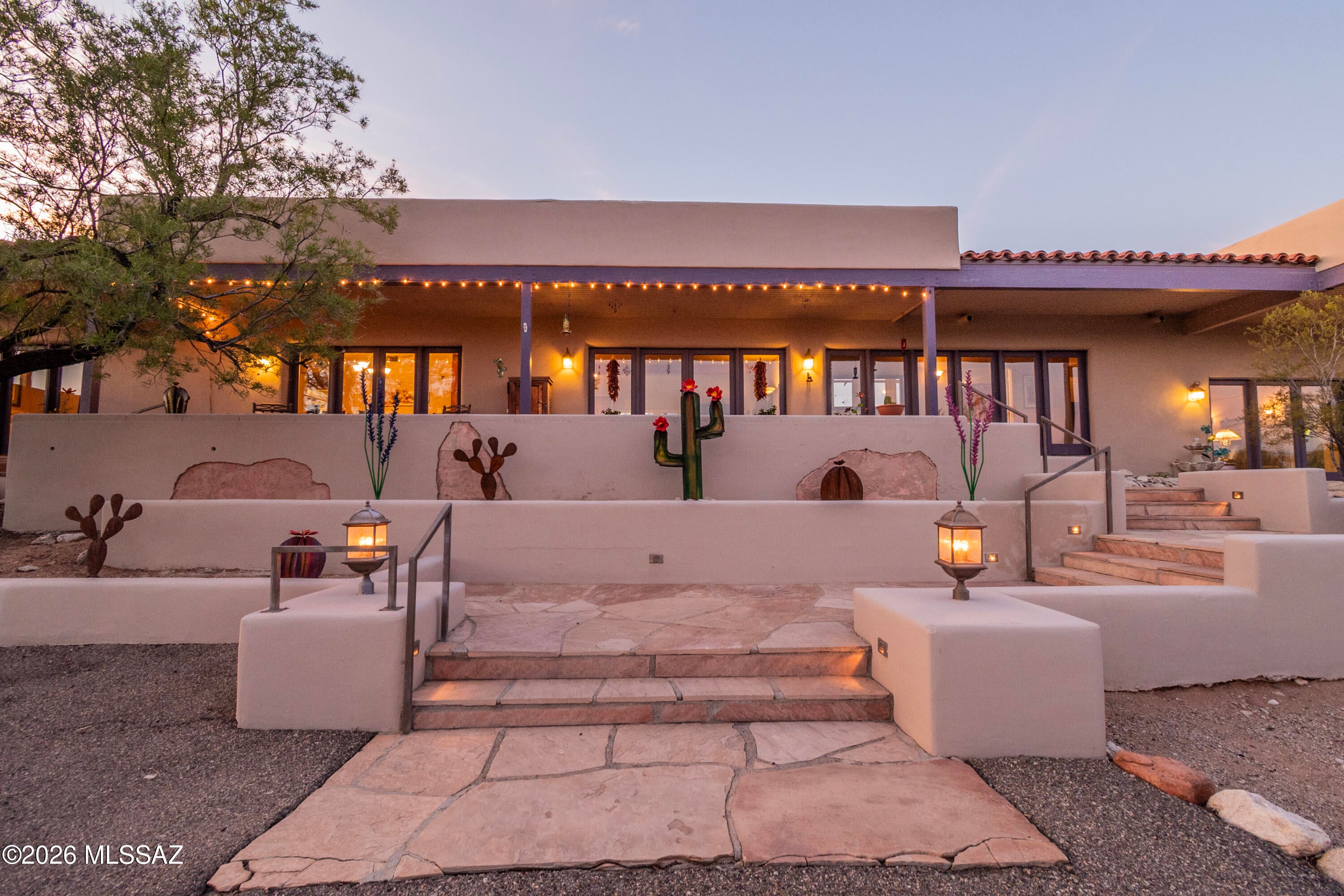 Rarely does a property come along that truly checks all the boxes-but this is that unicorn! Tucked away at the end of the cul de sac in Flecha Caida is this exceptional 4-bedroom, 3 bath home offering 3185 square feet with the perfect blend of privacy, foothills living and city convenience. Horse lovers will appreciate the 3 covered and lighted stalls, hay storage, tack room, turn out/arena, and easy access to nearby trails. Just saddle up and go!  Paved, circular driveway provides impressive curb appeal and convenience. Front porch sitting is the perfect place to capture the stunning city views that come alive after sunset. When it's time to cool off after that trail ride, step into the backyard and enjoy the Catalina Mountain views while cooling off in the sparkling pool. We haven't even been inside yet. Great room concept where the kitchen flows effortlessly into the living room keeps the natural light and views from every angle. Split floor plan has 2 bedrooms plus an en suite on one side then the private primary suite on the other. Every bedroom has a french door to the outside. Natural light fills this home. Large bonus room gives you views in every direction. Adding to this home's unique charm is Ginger, the resident desert tortoise, whose custom sanctuary conveys with the home, a family member that everyone will love.
Properties offering this combination of views, pool, horse facilities and premier foothills living rarely become available. This truly is the unicorn you've been waiting for.