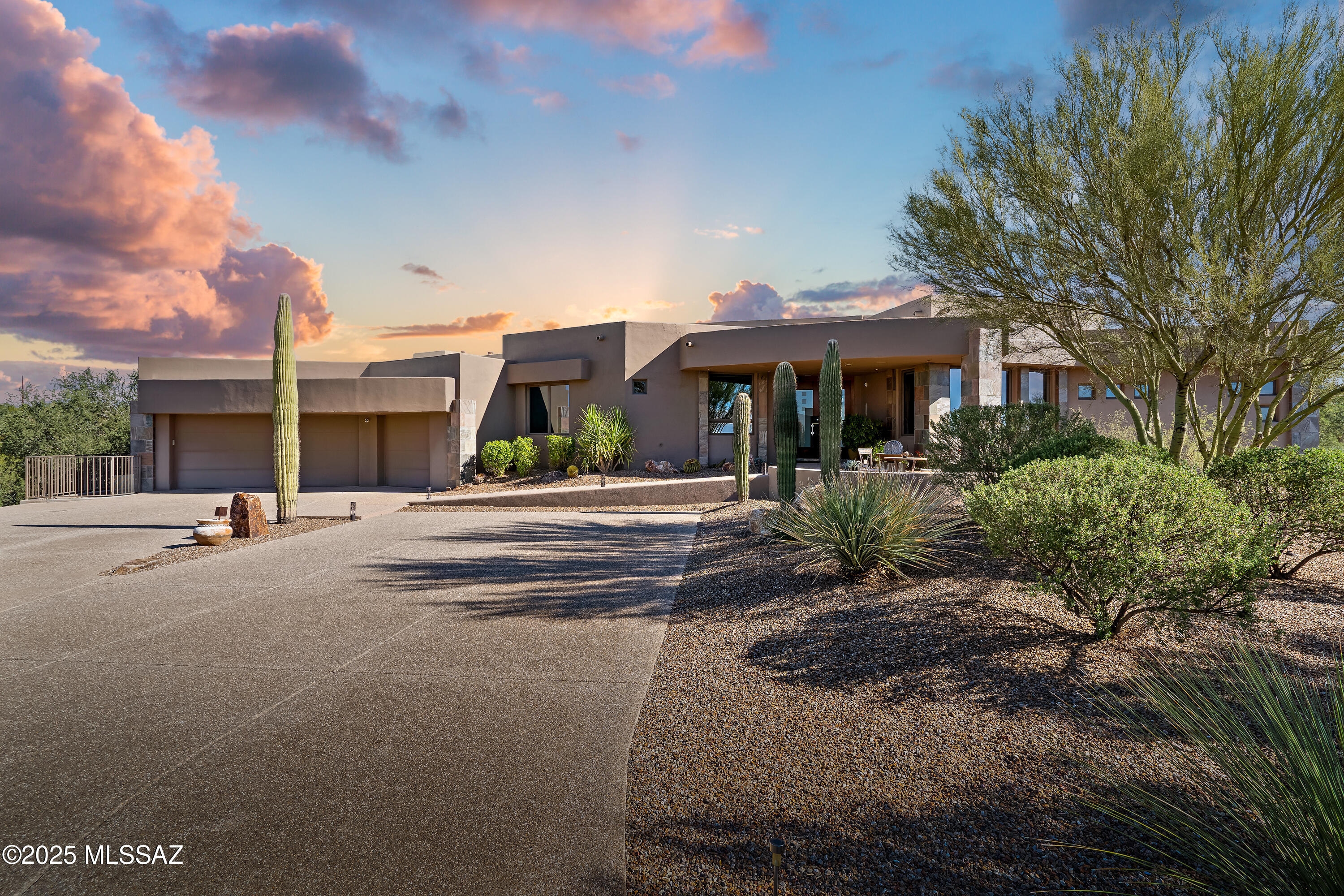 Come enjoy the location, exclusivity and privacy of this very special Oro Valley home. Custom built, this home features 4 bedrooms, 5 bathrooms, an office with built in desks/cabinets, game room, fitness area and a separate 1 bedroom, 1 bath guesthouse with a living area and kitchenette. Oversized 3 car garage with large laundry room. Sweeping mountain views from nearly every window on this elevated 4.67 acre lot. Enjoy spectacular views from your private backyard oasis with pool, spa, built-in BBQ and a separate viewing deck that captures the magnificent mountain and city views. A gourmet kitchen with double ovens, 2 dishwashers and a step-in pantry completes the entertaining possibilities. Designed in every way for both privacy and entertaining, this Oro Valley home stands out!
