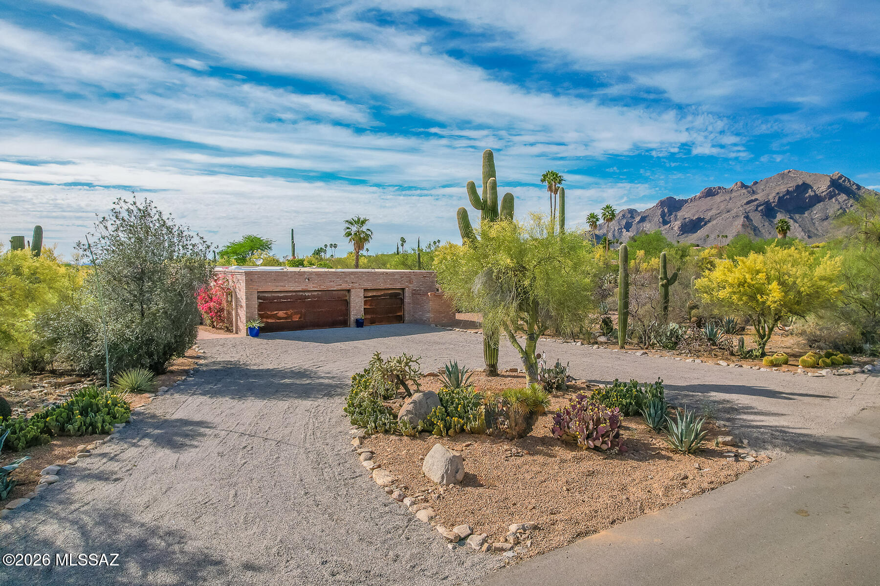 Prime Catalina Foothills # 9 neighborhood within walking distance to dining and shopping at La Encantada. 
This 4BD/3 BA home features solid burnt adobe construction, exposed cedar beamed ceilings in the family room with fireplace and wood interior doors throughout. Functional floor plan with separate living and family rooms, formal dining, breakfast area, and kitchen with walk-in pantry. 
North/south orientation with Beautiful backyard pool and Stunning Santa Catalina Mountain views. 3-car garage plus large storage area. Premium 1 ac lot!