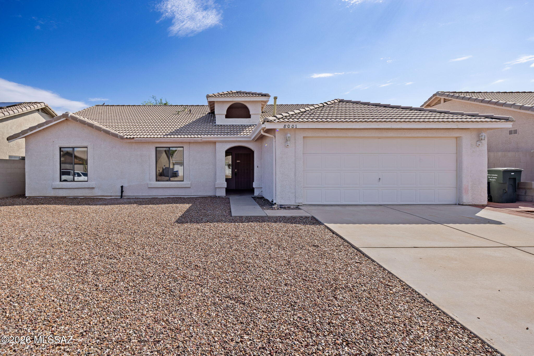 Move-in ready and ideally located in the heart of Rita Ranch, this spacious single-story home offers 4 bedrooms, 2 baths, 2,156 square feet in the award-winning Vail School District. The larger floor plan features an open, light-filled living area, a functional kitchen, and a generous primary suite designed for comfortable everyday living. Fresh interior paint and brand-new carpet give the home a crisp, turnkey feel. Enjoy easy one-level living with a 2-car garage, tile roof, central cooling, covered patio, and a low-maintenance backyard ready for relaxing or entertaining. Conveniently close to Purple Heart Park, shopping, dining, and I-10, this home offers an easy commute and access to everything Southeast Tucson has to offer. Best of all, no HOA and rear green belt for privacy.