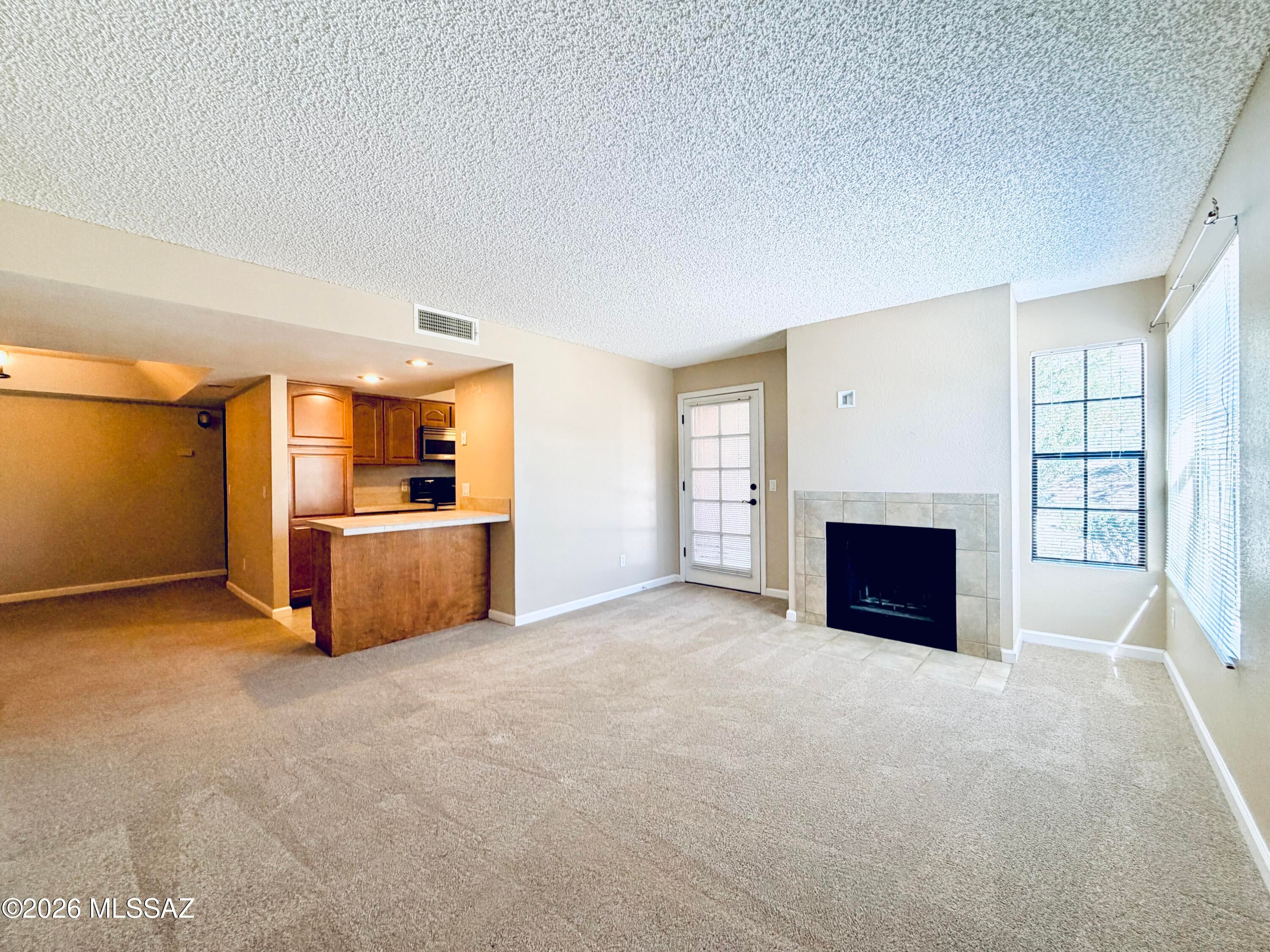 UNFURNISHED! This 1bdr/1ba Catalina Foothills condo is located in a RESORT style community w/sparkling pool spa, fitness center, tennis and more! Minutes to La Encantada shopping and a short drive to Sabino Mountain! Downstairs unit offers living room w/fireplace, dining room, kitchen w/counter seating for two. Master bedroom has private vanity, walk-in closet and patio access w/mountain views. Bathroom may be entered from the hallway or master bedroom. Water/sewer and trash are included.