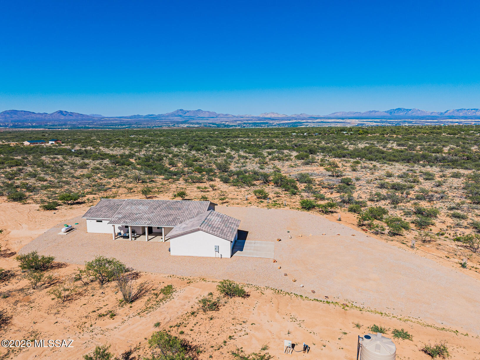 **Stunning Energy-Efficient Home on Expansive 10-Acre Lot with Breathtaking Mountain Views**

Welcome to your dream oasis! Nestled in a tranquil private square, this immaculate home offers an unparalleled blend of modern luxury and country charm. With an expansive 10-acre lot zoned RU4, the possibilities are endless - consider building a workshop, a quaint casita, or horse stables to embrace your equestrian lifestyle.

This exceptional property combines the best of modern living with the tranquility of country life. Don't miss your chance to own this energy-efficient sanctuary with limitless potential. Schedule your private showing today and envision the lifestyle that awaits you! **Key Features:**

**9 foot ceilings 
**Spacious Living**: The heart of this home is its open-concept living space, featuring a stunning a 5-panel sliding/folding door system that seamlessly integrates indoor and outdoor living. Natural light floods the space, enhanced by motorized custom shades and tasteful custom blinds throughout.

 **Chef's Delight**: Cook and entertain in style with a gourmet kitchen equipped with double ovens (including a gas range and electric built-in oven), a counter-depth refrigerator, a built-in microwave, and a dishwasher. The Mont Blanc Quartzite countertops and soft-close custom cabinets with pull-outs ensure both functionality and elegance.

**Luxurious Bathrooms**: Relax in the spacious master bath, featuring a large shower with steam shower doors and bench, as well as exquisite large-format tiles. The guest bath also boasts stylish finishes, accentuating the home's modern aesthetic.

**Energy Efficiency**: This energy-efficient home is fortified with 6" spray foam insulation throughout, ensuring comfort year-round while keeping utility costs low. The dual mini-split ducted HVAC system and Ecobee Smart Thermostats provide optimal climate control tailored to your preferences.

 **Outdoor Paradise**: Enjoy the serenity of your private 10-acre lot, adorned with a low-maintenance gravel yard and equipped with a drip irrigation system. Three covered patios provide perfect spots for outdoor dining, relaxation, and soaking in the stunning 360-degree mountain views.

**Modern Conveniences**: The property is equipped with a brand-new private well (registered in 2024) featuring a 2500-gallon storage tank, a pump saver, and a booster pump system from Western Hydro Engineering. The home is wired for modern living with security cameras, a Ring Doorbell, and an EV/Welding outlet in the oversized garage (24'x27'), which also boasts an epoxy-coated floor for added durability.

 **Additional Amenities**: This property is as versatile as it is luxurious, with pre-wiring for a hot tub/spa and ample room for future expansions. Enjoy the added security of a custom steel door, and benefit from the stainless-steel appliances and recessed lighting throughout.

- **Ideal Location**: With easy access to I-10, your new home offers a convenient commute to Vail, Davis-Monthan AFB, Tucson, Fort Huachuca, and Sierra Vista. Additionally, you are less than 100 feet from a paved county-maintained road, ensuring smooth access year-round.