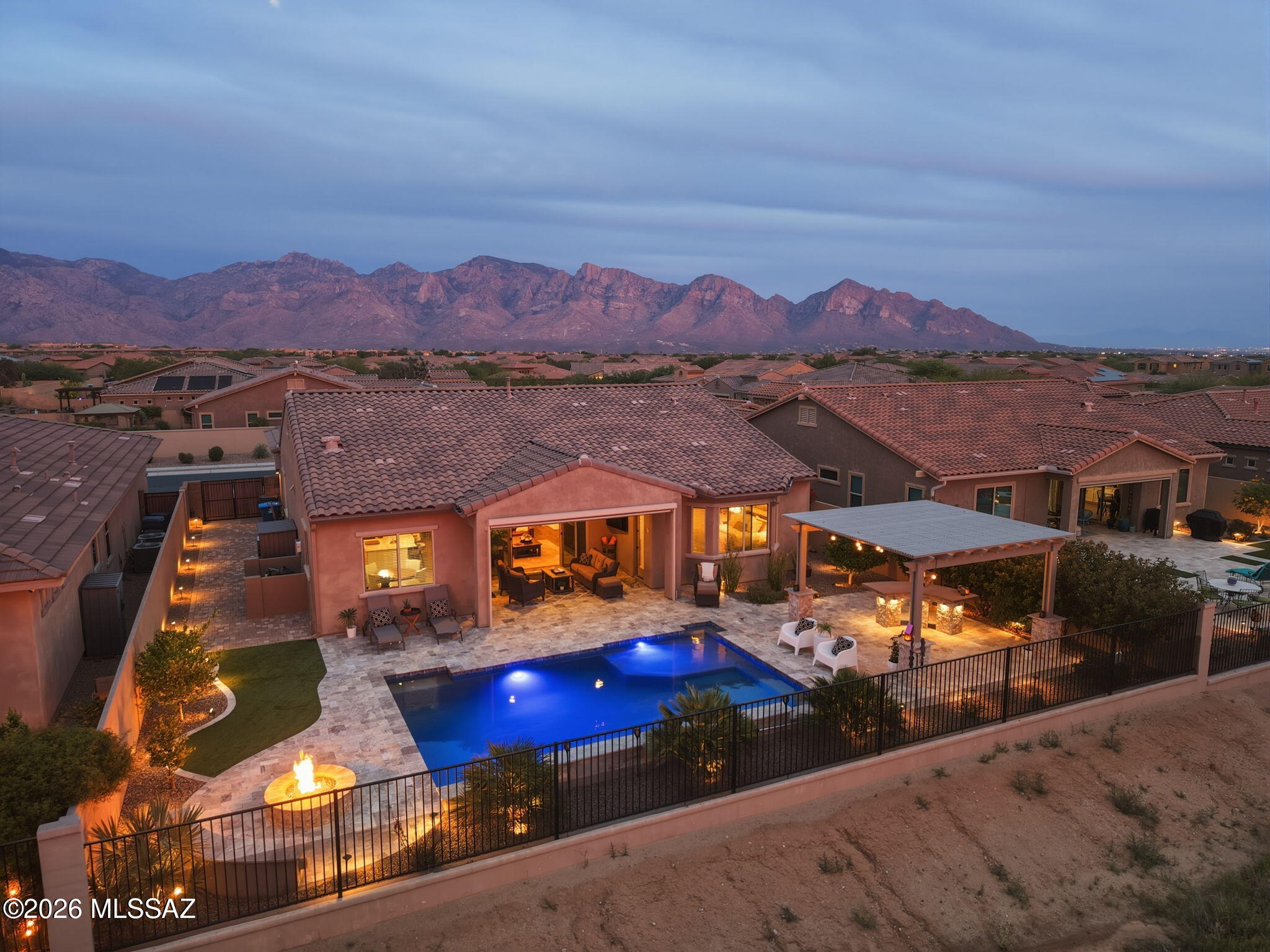 *** OPEN HOUSE FRIDAY 5/1, 4pm-6:30pm & SATURDAY 5/2, 11am-2pm***

Rare opportunity in gated Rancho Vistoso's Summit North--this 4BR/2.5BA / 3Car-tandem garage home captures expansive Catalina Mountain views from the front & unobstructed panoramic Tortolita vistas from the backyard, perfectly positioned along the protected Vistoso Trail & Nature Preserve. Designed for elevated desert living, the resort-style yard features a 2022 saltwater PebbleTec pool w/ waterfall, travertine hardscape, turf, gas fire pit, pergola w/ built-in bar, fruit trees, & ambient lighting. Extended pavers allow additional parking for vehicles or (approved) recreational gear. Also enjoy the soft water system, irrigation, & new rain gutters. Inside offers stainless steel appliances, walk-in pantry & spacious closets. A rare blend of privacy, views, & lifestyle in one of Oro Valley's most sought after communities! This home has had extensive outdoor and several indoor upgrades since its purchase. The home is a Maracay, Summit Parker Model. It's gorgeous!!!