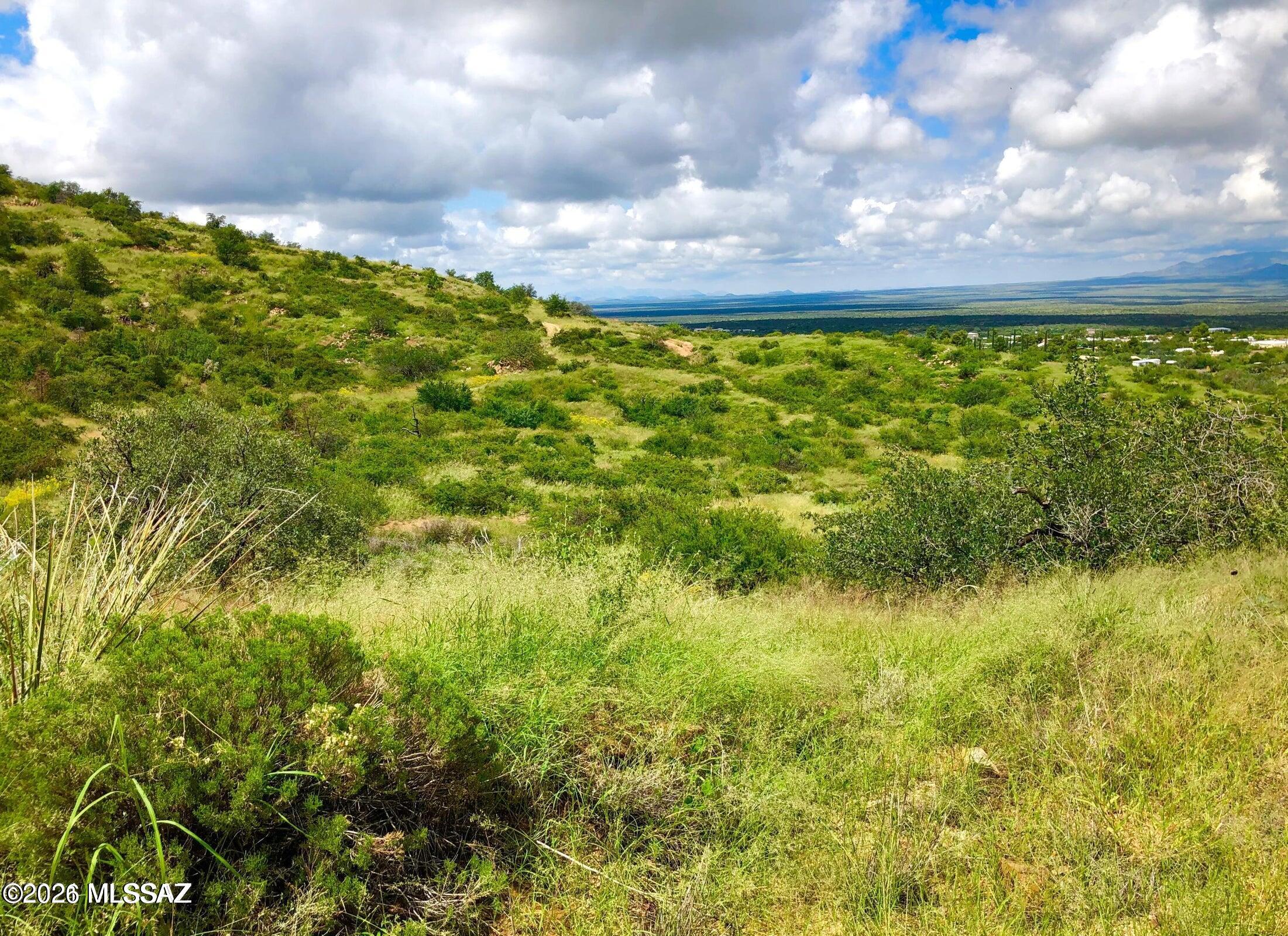 Spectacular 3.48-acre hillside retreat consisting of three contiguous parcels. The property offers a blend of rolling terrain, lush grasses, and numerous mature trees, providing both beauty and privacy. An old access road and two previously leveled areas suggest potential homesites with elevated views. A rare opportunity to own a picturesque piece of land with outstanding development potential.