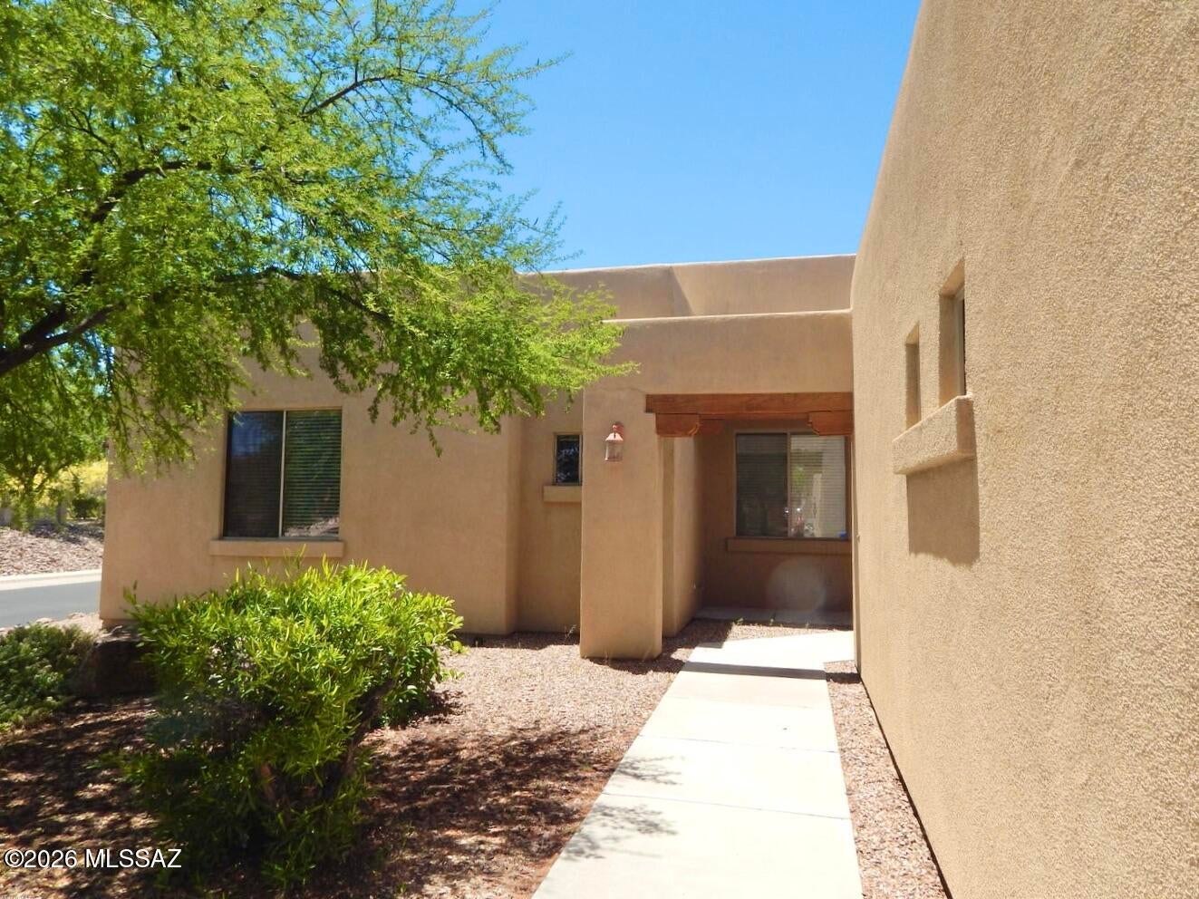 Corner lot with open space behind. Soaring ceilings. New carpet and interior paint. Gated community with community pool and spa.