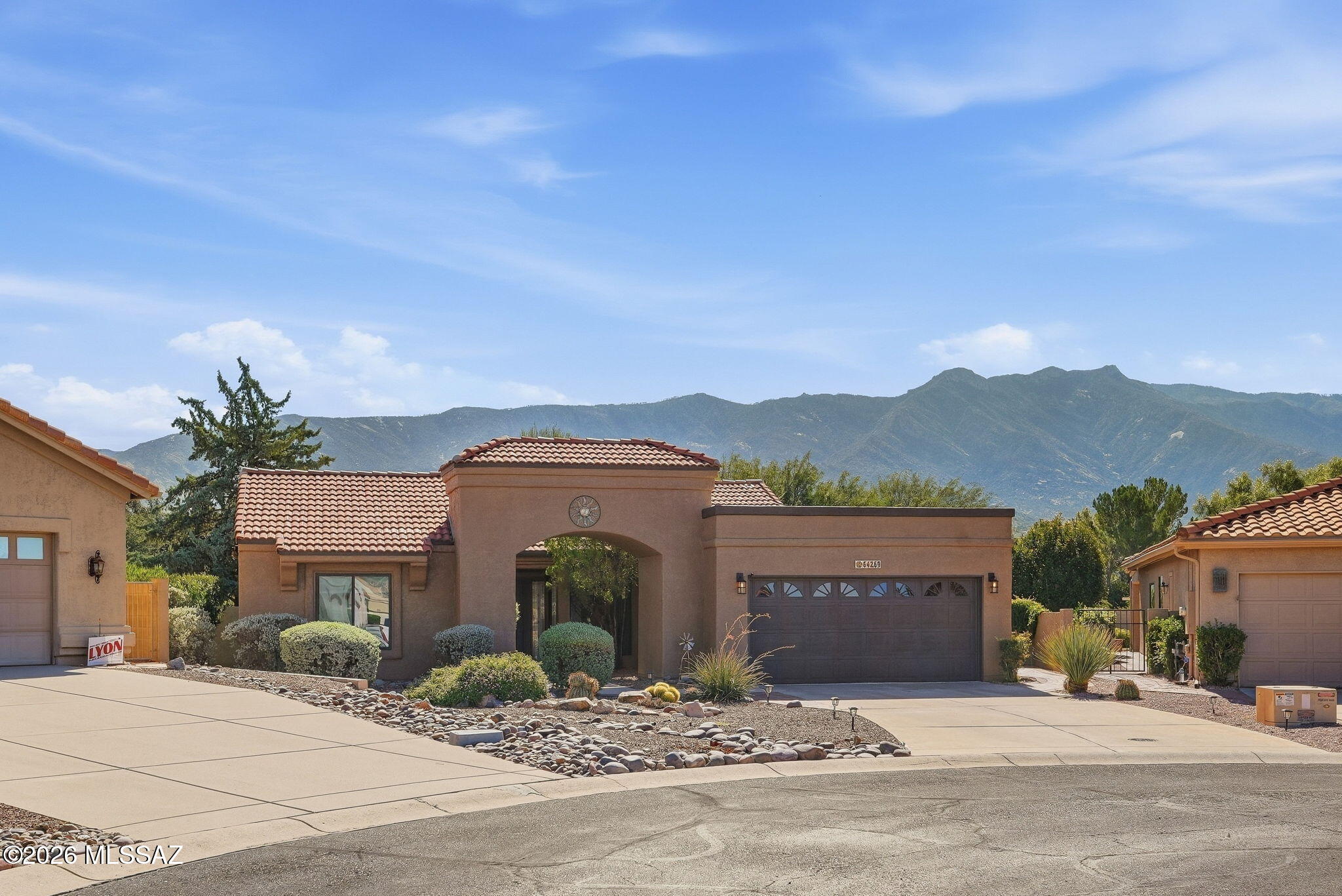Light and bright, this beautifully updated single-story home sits in the desirable SaddleBrooke HOA 1 on a spacious cul-de-sac lot. Vaulted ceilings and large picture windows create an open, airy feel. This inviting 2-bedroom, 2-bath home features LVP flooring and a remodeled kitchen with a Samsung Bespoke refrigerator, white quartz countertops, and a glass tile backsplash. Updates include fresh interior paint (2026), quartz bathroom counters (2026), mirrors and lighting (2026), roof underlayment (2024), exterior paint (2024), epoxy garage floors (2024), water heater (2025), and windows (2025). Enjoy the peaceful backyard and covered patio with ceiling fans. Move-in ready and beautifully maintained!