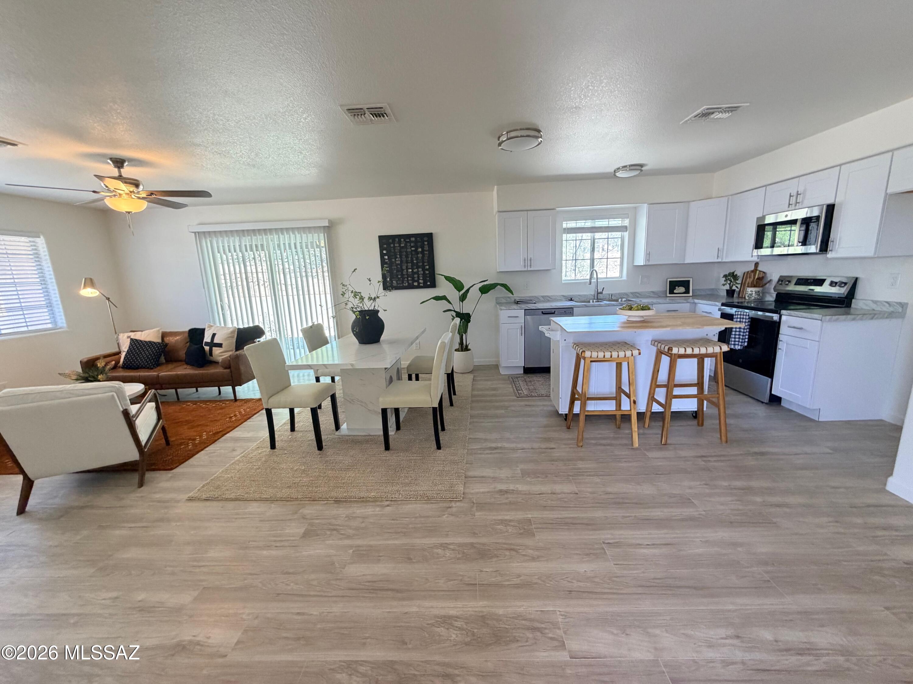 See stunning sunrises and sunsets from this totally renovated 4BR home, sitting on a full 1/2 acre atop the lovely green rolling hills of Rio Rico. All NEW, including new roof, new HVAC, all new kitchen and stainless steel kitchen appliances (D/W, stove, micro), new bathrooms, new luxury vinyl wood tile (LVT) flooring throughout, new plumbing and electric fixtures, the list goes on.   Septic pumped, passed, and ready to transfer.. Inc. full house termite warranty inside and out! Just 1+ mile to the fire station. The street shows pride of ownership. Don't miss this opportunity to own a home with everything NEW.   Virtually staged, Owner/Agent.