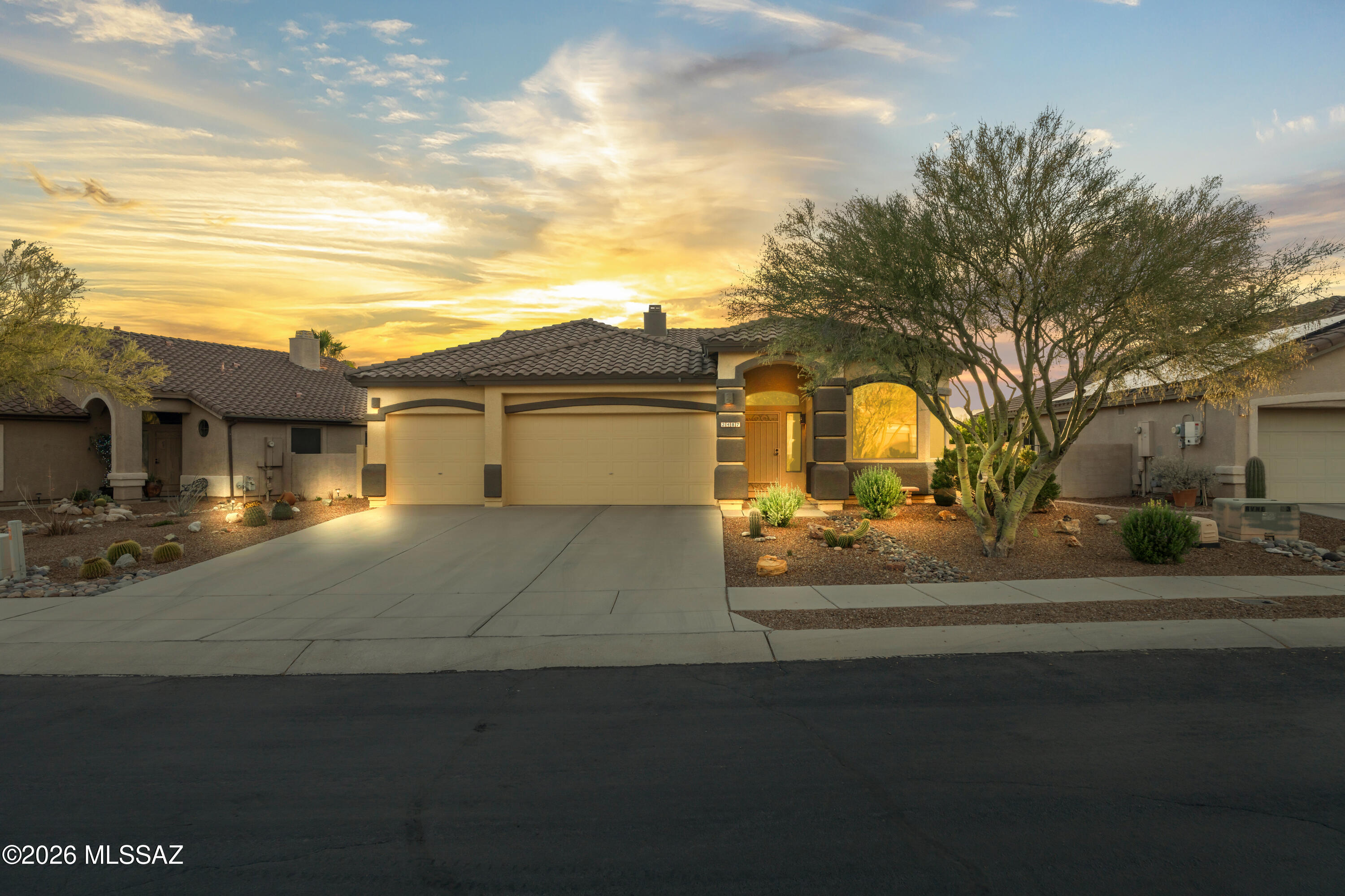 Sought-after Rancho Vistoso! This charming single-story 3BD/2BA home features soaring ceilings, an open floor plan & abundant natural light. The spacious kitchen boasts granite counters, a large center island with seating & wood cabinetry, all open to the main living area. The family room showcases a cozy fireplace with custom built-in surround. The primary suite features dual vanities, soaking tub, separate shower & a large walk-in closet with built-in organization. Enjoy Oro Valley's legendary sunsets from your covered patio. Oversized 3-car garage provides exceptional storage. Close to top-rated schools, hiking trails, golf, shopping & dining along Oracle Road. Virtual staging shown in select photos. Home is owner-occupied & in transition. All offers considered.