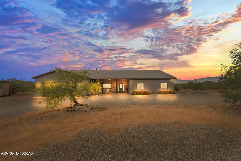 Commanding space, design, and desert presence 16276 E Empire View Rd delivers. This 2,766 sq ft. custom 4-bedroom residence features a true split floor plan with every bedroom offering a walk-in closet, rare at this level. Polished concrete floors and quartz surfaces create a clean, modern edge, anchored by an expansive kitchen with oversized island and walk-in pantry. The secondary bath impresses with a full glass walk-in shower, elevating everyday living. An 82-ft covered patio defines the experience seamless indoor/outdoor living overlooking a fenced turf yard and open desert beyond. Set on a premium homesite with oversized garage, metal roof, and room for toys, animals, or expansion.  This a home that combines modern finishes, usable land, and an unmatched outdoor living experience.