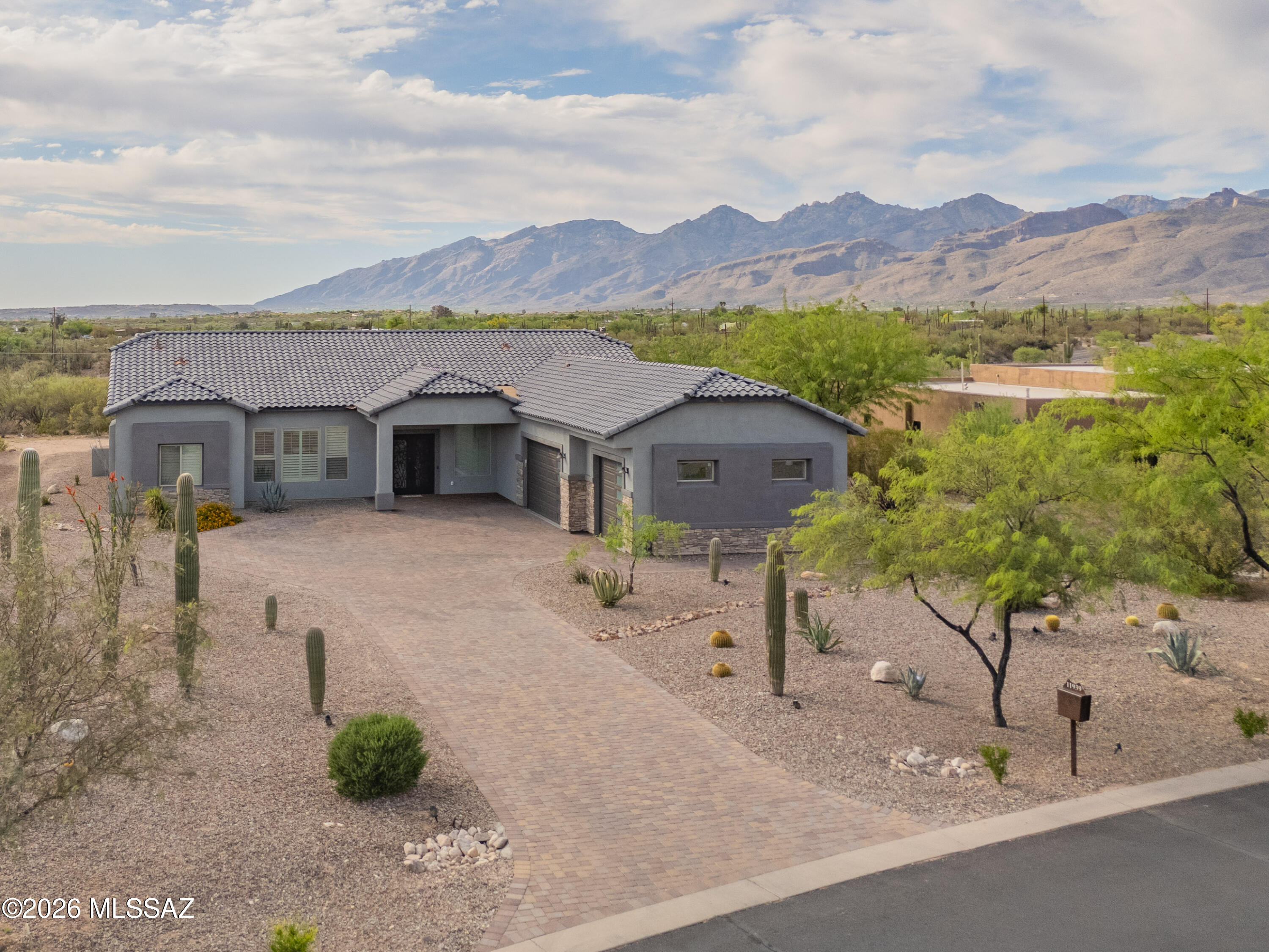 A Tanque Verde Foothills Gem!  This 4BR/3.5BA/3 Car Garage home in the beautiful community of Rancho Soldados is available for you to call home! Beautiful eat-in kitchen, great room, and formal dining room provide the perfect entertaining area.  Custom touches throughout this home including quartz countertops throughout, tiled showers and bath surrounds, gourmet kitchen, walk-in pantry, custom lighting, window coverings throughout including interior shutters in Great Room, kitchen and owner's suite.  Rear yard completely landscaped and covered patio to enjoy the view of the Catalina Mountains!
