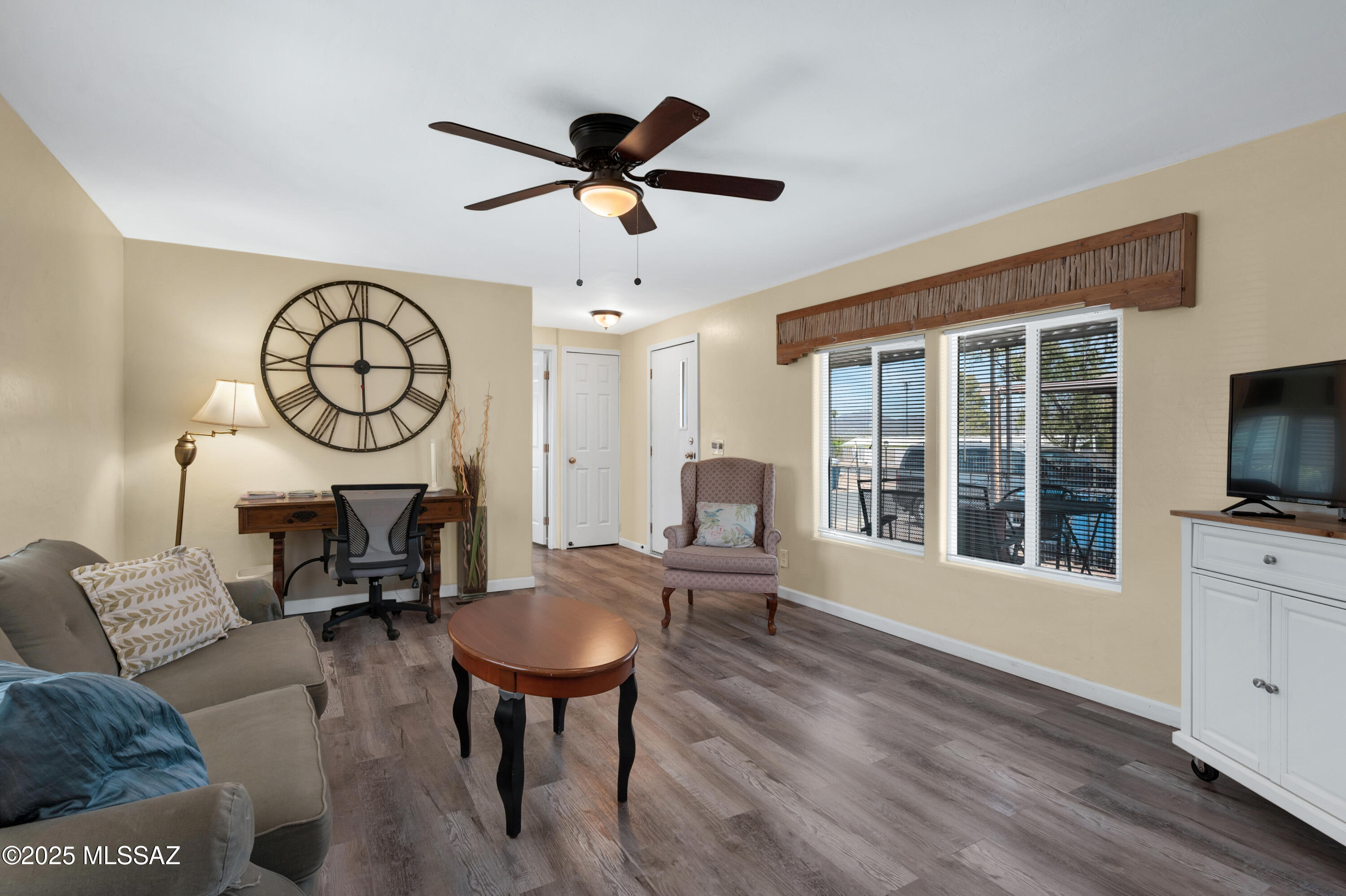 Welcome to this beautifully updated 2-bedroom, 2-bath residence, where timeless charm meets modern convenience. Thoughtfully remodeled from top to bottom, this home showcases quality craftsmanship, high-end finishes, and a contemporary aesthetic that is both stylish and functional. Whether you're searching for a peaceful retreat or an entertainer's dream, this home delivers comfort, privacy, and lasting value in a prime setting. Step inside to discover a desirable split-bedroom floor plan, ideal for both everyday living and hosting guests. Every detail has been carefully considered, beginning with all-new insulation and energy-efficient windows that enhance year-round comfort and reduce utility costs. The updated flooring flows seamlessly throughout the home, complemented by lighting fixtures that add warmth and sophistication to each space. The fully renovated kitchen is a true highlight, featuring sleek cabinetry, updated counters, and a streamlined layout that offers both style and function. Ceiling fans have been thoughtfully placed throughout to provide added comfort and air circulation. Both bathrooms have been completely reimagined with tasteful finishes, including new vanities, contemporary fixtures, and beautiful tile work. The spacious primary suite features a private, tranquil setting with a charming barn door entry that adds character and flair. Additional upgrades include a fully modernized electrical system, enhancing safety and efficiency for years to come. Step outside to enjoy not one, but two covered porches-perfect for morning coffee, evening conversations, or entertaining under the Arizona sky. The surrounding park is immaculately maintained, offering paved streets and sidewalks in a peaceful, community-oriented environment. What truly sets this property apart is the absence of any HOA or monthly fees-an increasingly rare benefit that provides more freedom and financial flexibility for the homeowner. This turnkey home is an exceptional opportunity to own a thoughtfully updated, move-in-ready property in a well-kept community. Don't miss your chance to experience the perfect blend of style, comfort, and value. Schedule your private showing today!