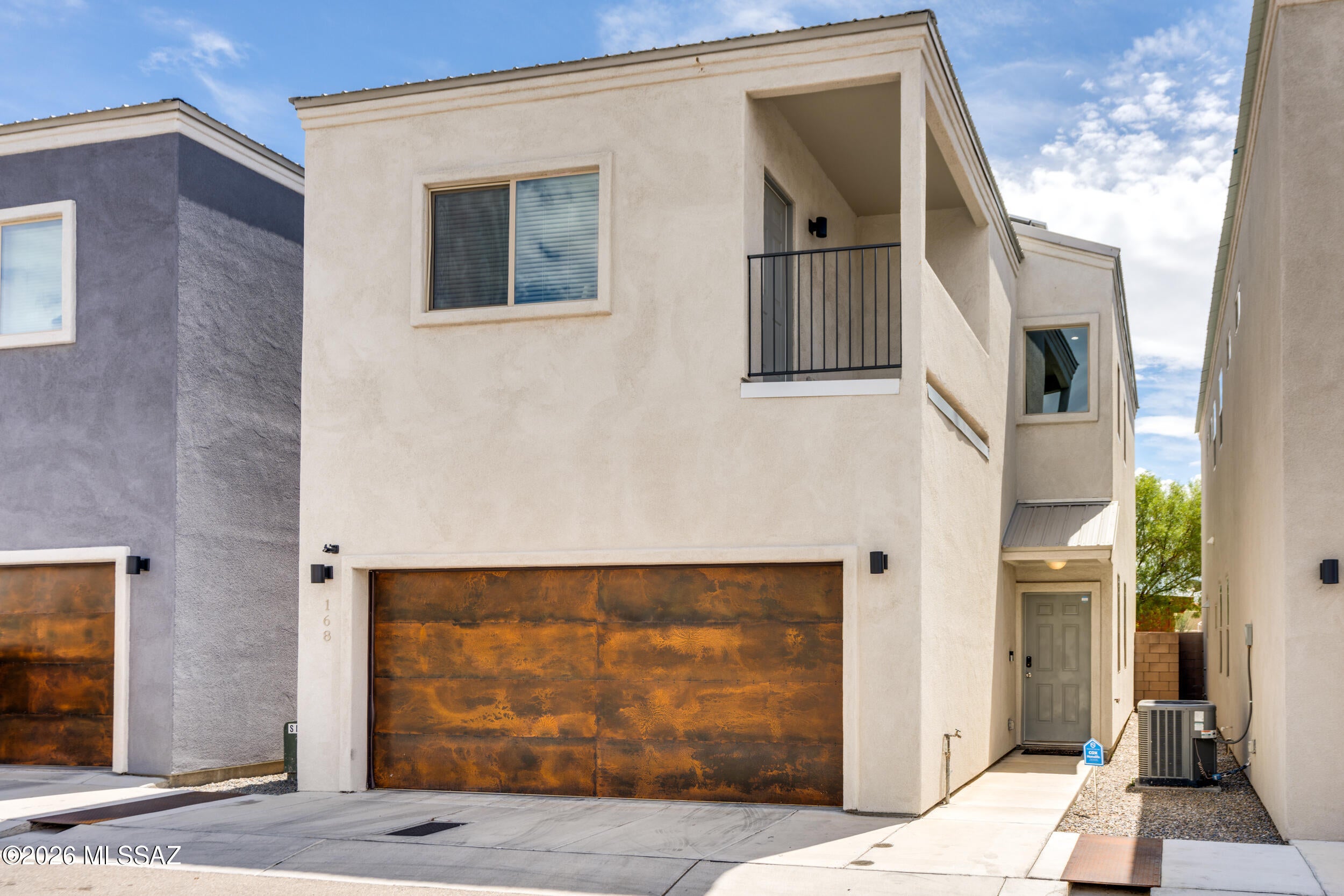 Range Priced- Seller will accept or counter offers within the range of $385,000-$420,000

Modern style meets functionality in this highly upgraded home featuring stained concrete floors, dramatic 21' entry ceilings, abundant storage, and an open-concept design. The kitchen showcases stunning granite countertops and custom executive-height cabinetry. Two generously sized primary suites offer exceptional flexibility, including a main suite with dual vanities, walk-in tiled shower, and oversized walk-in closet, while the second features a private balcony ideal for enjoying Tucson sunsets.

The backyard is designed for low-maintenance Arizona living, complete with an added ramada creating the perfect space for entertaining, dining, and relaxing outdoors. Even better--OWNED SOLAR means practically NO electricity bills! Complete with a 2-car garage and a convenient central location just minutes from Downtown Tucson, the University of Arizona, and Tucson Mall and a NO HOA comunity!

* Furnishings are available with a separate bill of sale!