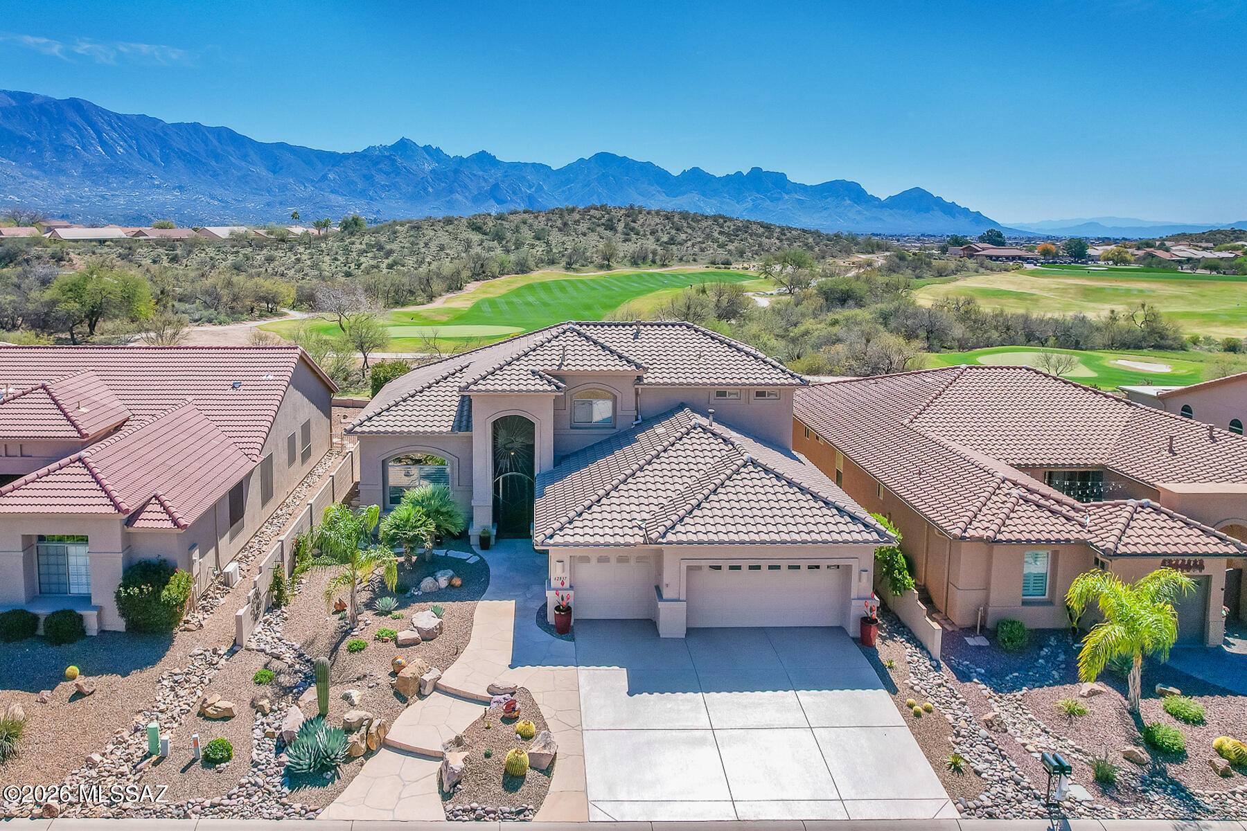 Absolutely stunning Sundance Model situated on an elevated $250k Premium Lot overlooking the Golf Course with Panoramic Mountain Views. This exquisite desert retreat offers 3 bedrooms, 2.5 baths, den/office, formal living/dining plus open concept Great room affording ample space to relax or entertain. Commanding front entry flows to a grand foyer with winding wood banister staircase. Luxurious Primary Suite with spa worthy bath resides on main level with 2 upper level guest rooms hosting Jack N Jill baths. Thoughtful upgrades and amenities including Energy Star Construction, customized patio and view windows, gourmet island kitchen with Quartz countertops, Stainless appliances and upgraded Hickory cabinets, built-in media center with pivoting TV and surround plus wired sound throughout, security system and command center for specialty wiring. 3-car garage with 4' extension houses water softener, whole house water filtration, recirculating hot water heater plus 50 amp outlet, central vacuum and workshop area. Step outdoors and experience extensive flagstone pavers, a soothing fountain plus breathtaking mountain vistas. Exterior features include rolling sunscreen off primary bedroom plus 2 rolling sunshades on rear patio, hard piped irrigation, multiple external outlets and easy care desert landscape front and rear. A phenomenal retreat in the premiere SaddleBrooke Two active adult community.