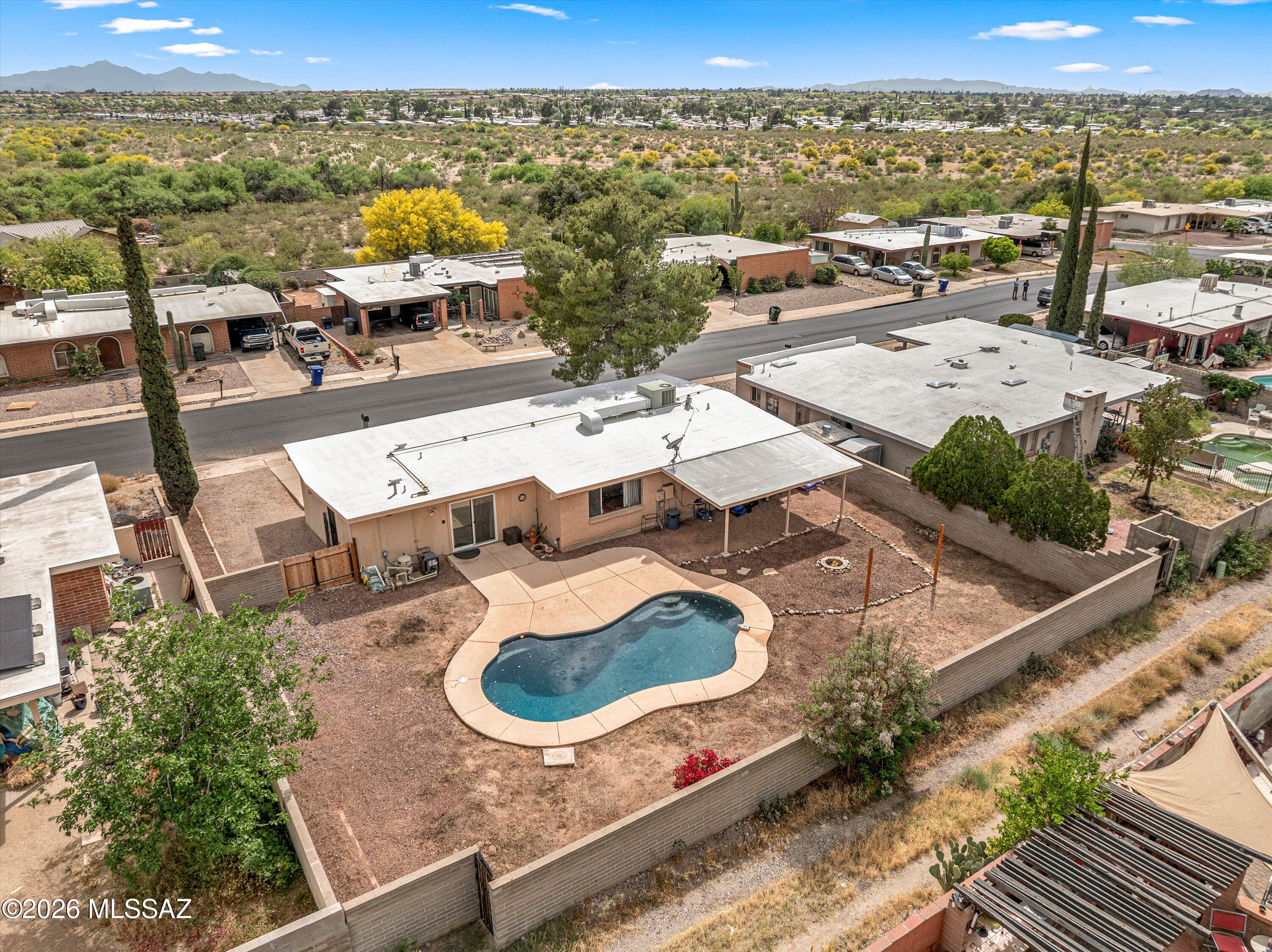 Classic 3BR/2BA slump block ranch-style home with a heated pool in the popular Eastside neighborhood of Hearthstone Hills.  This beautifully maintained home blends timeless Southwestern charm with modern upgrades including a 1 car garage with storage closet, renovated eat-in kitchen with stainless steel appliances, open floor plan with an abundance of natural light, private low-care backyard with firepit, pool and covered North facing patio, recently replaced carpeting, ceiling fans, North / South exposure, washer / dryer, primary suite w/ roomy walk-in closet and a convenient location near shopping, restaurants and the neighborhood is adjacent to the Pantano River / Michael Perry Park with playground, baseball fields, basketball court and access to the Chuck Huckelberry Loop.