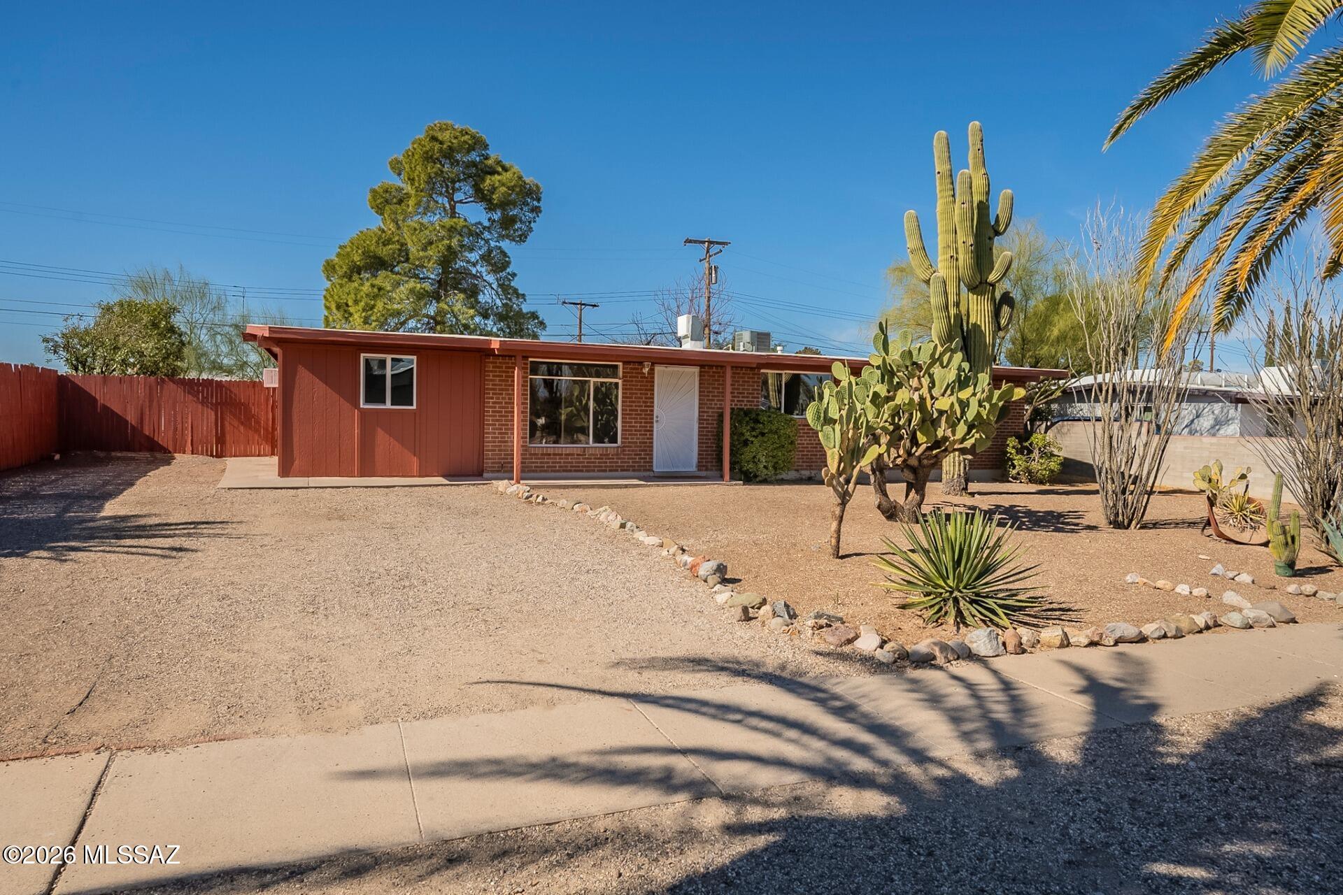 1,500 SQ FT! 4-bedroom, 2-bath home in Tucson's desirable Terra Del Sol neighborhood. This single-story home features a charming kitchen with included appliances: dishwasher, oven, and refrigerator. The great room layout offers an open and inviting living space, complemented by neutral tones and tile flooring throughout. The primary bedroom includes a full bath for added convenience. Three additional bedrooms provide plenty of space. Low-maintenance desert landscaping in the front and backyard, plus a covered patio for outdoor enjoyment. Driveway parking available! Conveniently located near schools, parks, dining, and entertainment.
