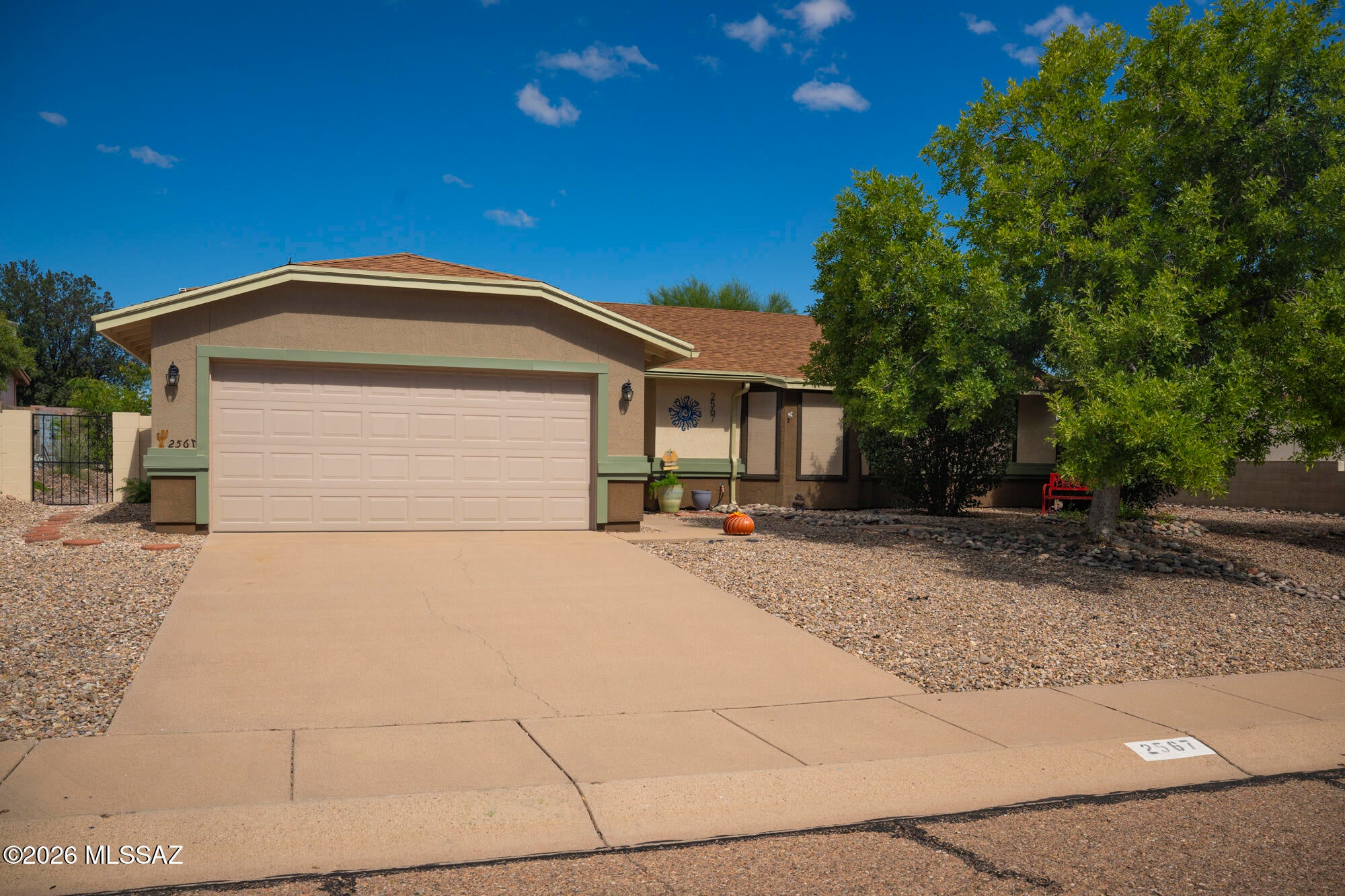 Welcome to this well-maintained 1989 site-built home offering 3 bedrooms, 2 bathrooms, a 2-car garage & an impressive list of updates! Freshly painted inside & out, the home feels clean, bright & move-in ready. Recent improvements include newer security doors, ceiling fans in every room, newer ceramic tile in both bathrooms, a mini-split system in the living room & a newer sink & faucet in the main bathroom. Window blinds are already in place & the washer & dryer are included for added convenience. Step outside to enjoy the beautifully landscaped grounds, creating an inviting setting for relaxing or entertaining. With thoughtful updates, practical amenities, & attractive curb appeal, this home is ready to welcome its next owner!