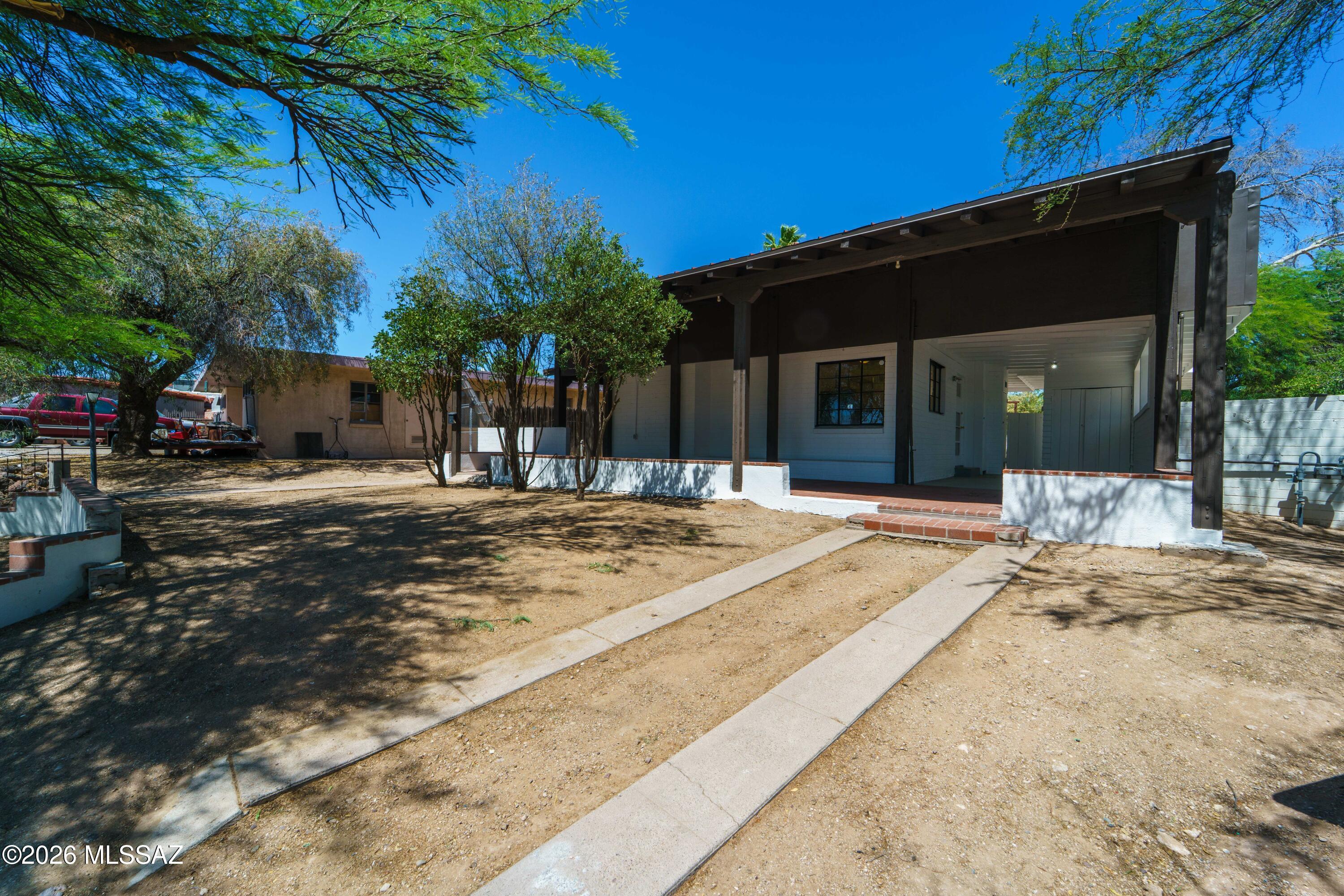 Super cute 2bd/1bath in historic Sam Hughes. Amazing opportunity to get into one of Tucson's classic neighborhoods.  Plenty of character, beamed ceilings and lots of light throughout. Stainless steel countertops make clean up a breeze. Two covered patios including a large covered back patio offers out door living as well as a huge yard to make your own.  Comfortable city desert living with possibilities to add on or update to your liking. This home is ideally situated near the University of Arizona, Downtown Tucson, and the revitalized Rancho Center, home to Whole Foods Market. Nearby amenities along the Sunshine Mile include Natural Grocers, Trader Joe's, along with a growing collection of local restaurants, cafés, and neighborhood businesses. This home is ideally situated near the University of Arizona, Downtown Tucson, and the revitalized Rancho Center, home to Whole Foods Market. Nearby amenities along the Sunshine Mile include Natural Grocers, Trader Joe's, along with a growing collection of local restaurants, cafés, and neighborhood businesses. Historic character, modern livability, and one of central Tucson's most connected locations come together in this classic Tucson home.