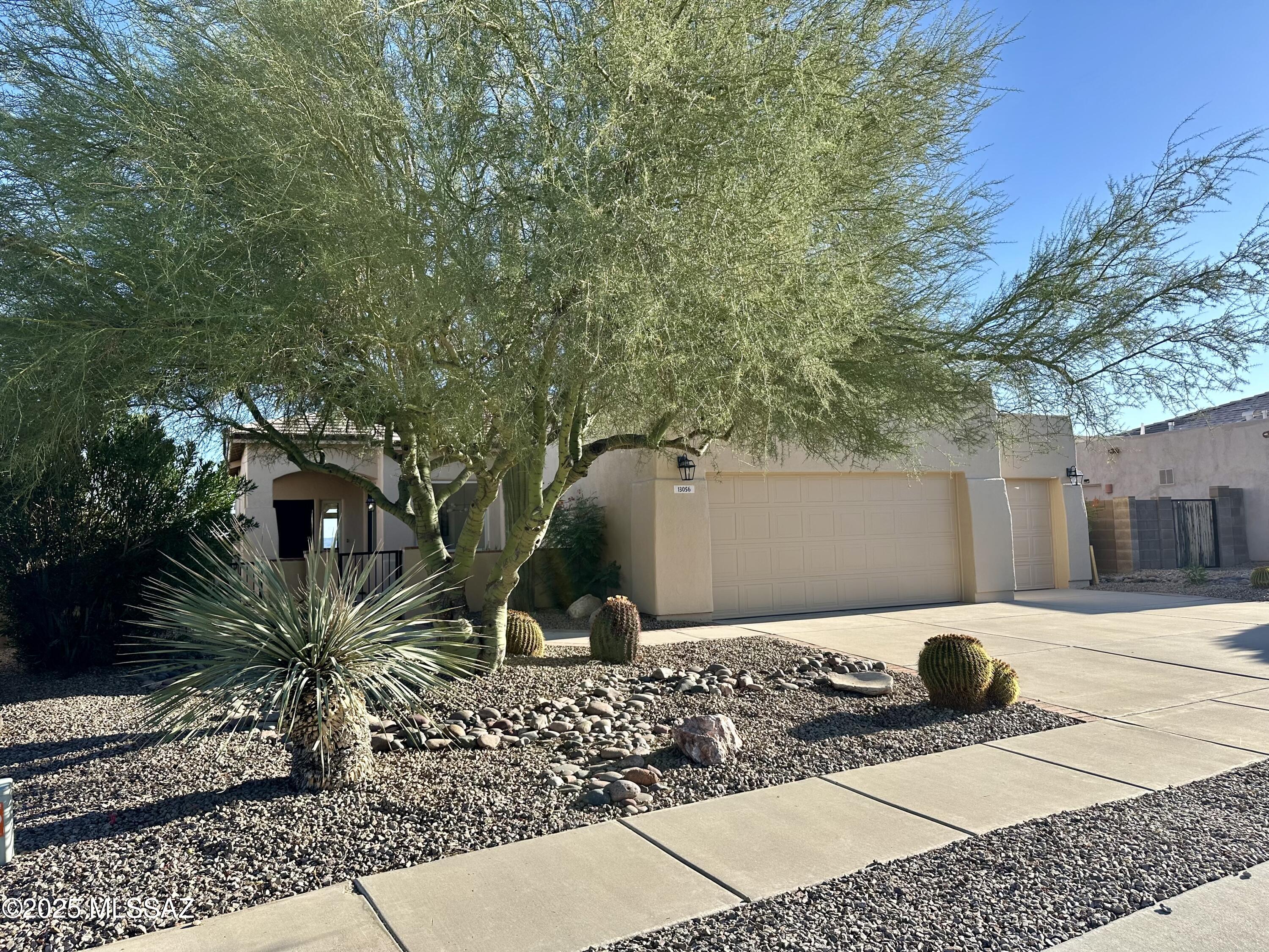 Enjoy ENDLESS VIEWS from this stunning 3 bed/2 bath home with oversized 3 car garage. Home backs to natural desert with views of mountains, sunsets, and CITY LIGHTS. No neighbors behind this .34 acre lot with view fence. Home has been COMPLETELY UPDATED and STAGED. New paint, kitchen has gas range, new 42'' cabinets and quartz countertops, new stainless sink, faucet, and microwave. All new lighting and ceiling fans.  New carpet in bedrooms, dual sink executive height vanities with quartz in master bath. PELLA FRENCH DOORS lead to the oversized covered back patio that is made for entertaining. New roof (2022) New exterior paint. Refrig and W/D included. Enjoy coffee in your private front COURTYARD. Close to golf, hiking trails , Ritz Carlton resort, and parks. Owner/Agent Refrig and W/D included. Enjoy coffee in your private front COURTYARD. Close to golf, hiking trails , Ritz Carlton resort, and parks. Owner/Agent.