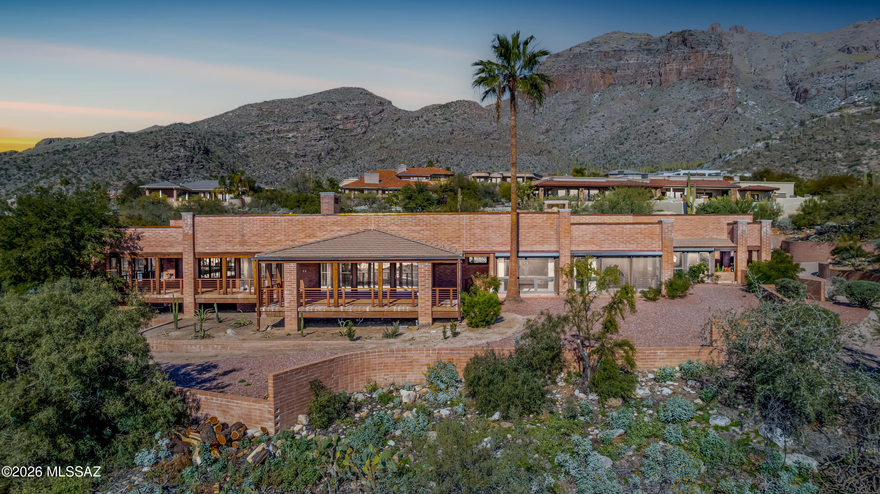 Perched atop prestigious Cobblestone Drive, this exceptional estate formally known as The Coors Estate sits on a rare almost 2-acre double lot, offering privacy, panoramic views, and an expansive one level footprint designed for both entertaining and everyday living. The 7,277 sqft residence showcases timeless architecture and commercial-grade steel l-beam construction & copper accents. 

Designed for seamless indoor-outdoor living, the home features an extensive covered patio system (3773 sf) ideal for entertaining or enjoying Tucson's sunsets year-round. A unique highlight is the indoor pool with heating and cooling, creating a private retreat that can be enjoyed in every season. Located in highly desirable Catalina Foothills with easy access to fine dining, shopping and outdoor recreation, this estate presents a rare opportunity to own a timeless property with remarkable presence and unmatched potential!