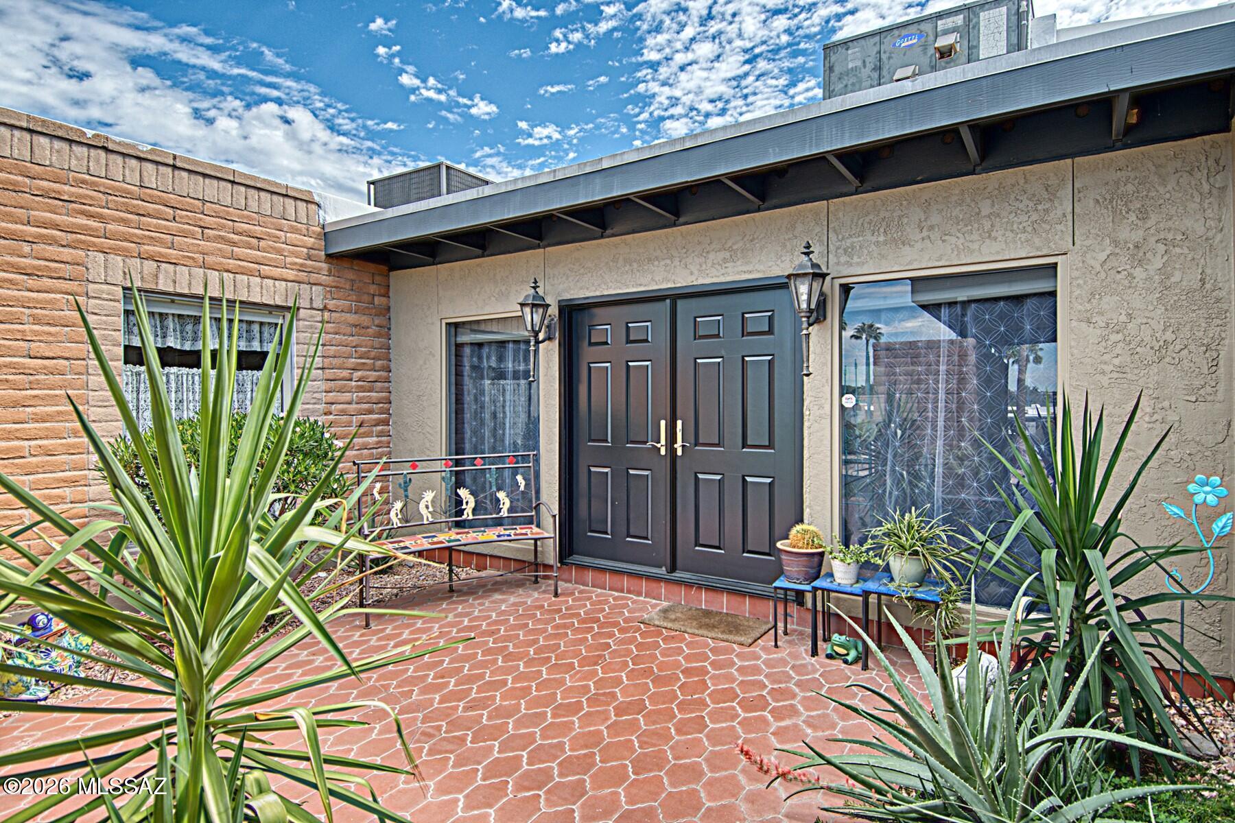 Seller will accept or counter offers received between $525,000 and $550,000.   If you are looking for an expansive townhome, perfect for entertaining and the arts, look no further!  At 2757 square feet, it is one of the largest single story townhomes in the NW Tucson area.  A huge 594 st ft great room, Saltillo tile throughout the home, this Southwest style residence has large picture windows for natural light, a low maintenance private backyard with private access to a nature walking trail, and is close to shopping and amenities.  The two space carport has a large locking storage area for all of those garage items!  Recently updated with a gas cooktop and brand new Anderson front doors and a 2024 date refrigerator.  HOA only $131 per month with two pools.  Two gas fireplaces, 2 bedrooms 2 full baths, flex area, dining room, entry, great room, kitchen, small office, tons of storage.  Great room has 9' ceilings.  Huge bedrooms--both around 300 sg ft--and a 324 sg ft covered patio.  Find out what the best Oro Valley can offer!