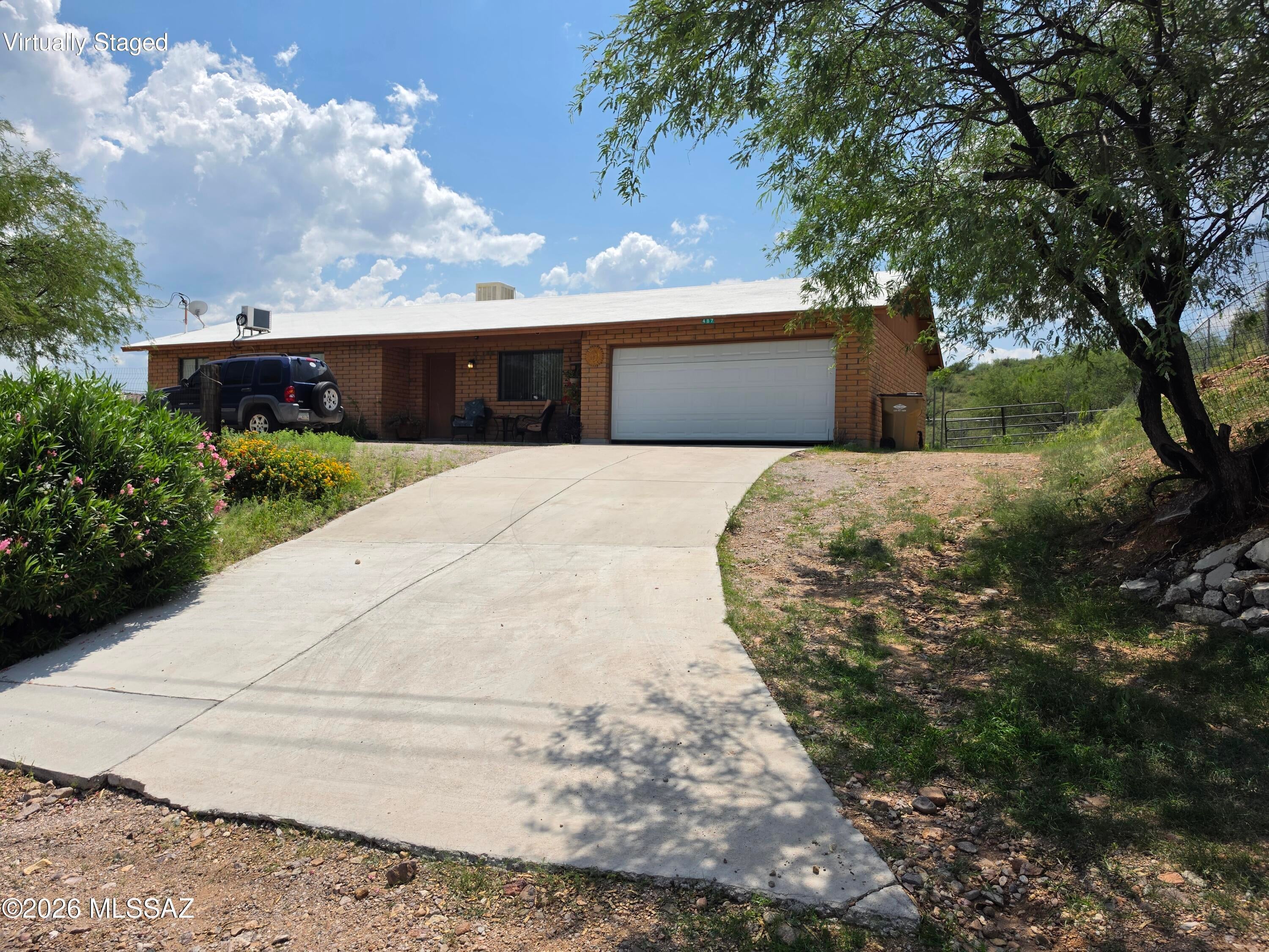 This 3-bedroom, 1.5-bathroom home combines practical daily features, efficient climate control, and breathtaking scenic views.Three comfortable rooms offer flexible space for family, guests, or a home office. One full bathroom sits near the bedrooms, plus a convenient half bathroom for guests. Durable tile floors run through the entire house for easy cleaning. Four mini-split units let you adjust the temperature in different areas of the home independently. A covered back patio provides a shady place to sit and enjoy the outdoors. A strong chain-link fence encloses the yard safely for pets or play. Solar panels
