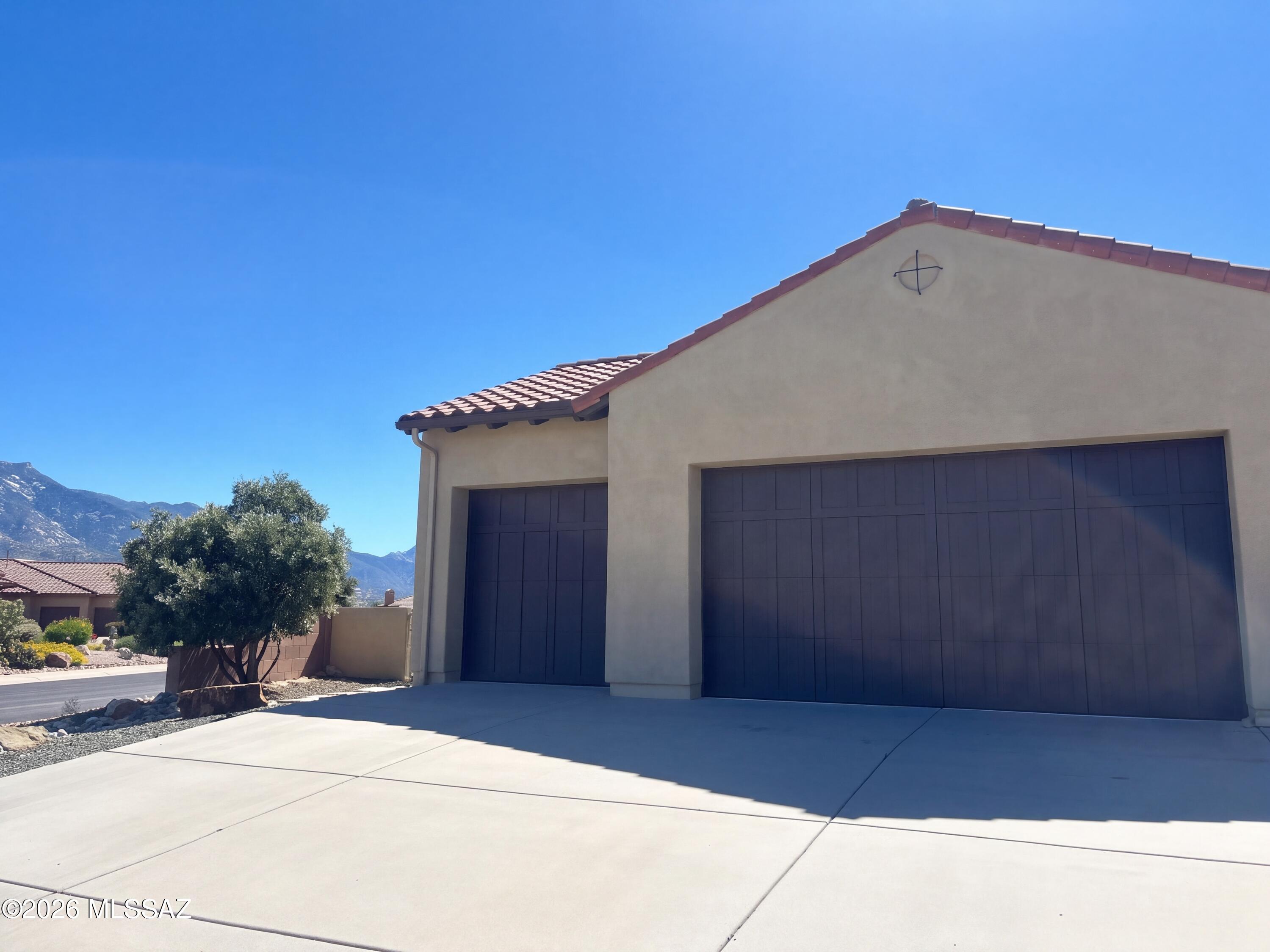 Beautifully updated SaddleBrooke home in the quiet Desert Sun cul-de-sac. This 2-bedroom, 2.5-bath home offers 2,599 sq ft with a versatile office/den, open living and dining areas, and a bright kitchen with breakfast nook and pantry. Primary suite with private bath and walk-in closet. Owned solar panels, gas fireplace, covered patio, and low-maintenance gravel landscaping front and back. Refrigerated air (split HVAC, 2018) and gas water heater. Attached 3-car garage with built-in storage. Located in the 55+ SaddleBrooke community with golf, clubhouse, pools, and fitness amenities. Seller prefers buyer uses Opendoor title and escrow.