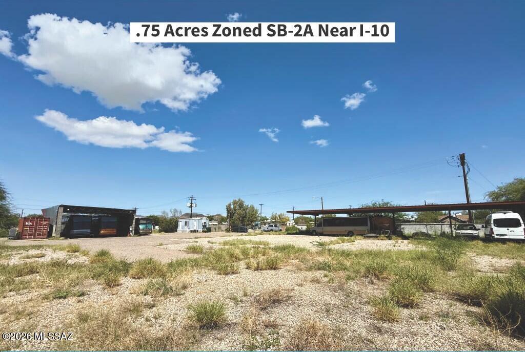 Development Opportunity Near I-10 in South Tucson. Approximately 0.75 acres across two parcels, zoned SB-2A, offering a commercial development site with convenient access to I-10 and major South Tucson corridors. The property features an existing inspection/service pit, two covered ramadas, Shipping Container, and a small livable trailer unit, providing potential utility for an owner-user or redevelopment project. The site's location and commercial zoning make this an opportunity for investors, developers, and businesses seeking a strategically located parcel with existing improvements.
