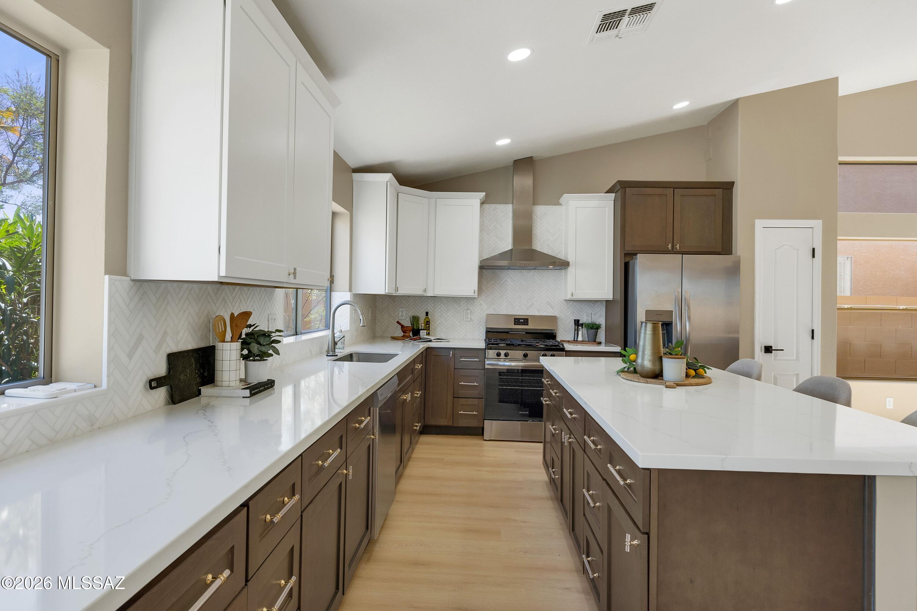Wake up to breathtaking Catalina Mountain views in this beautifully updated 3-bedroom, 3-bath home plus den & 3 car garage. Perfectly positioned with no homes behind, this property offers privacy, serenity, and truly stunning panoramic scenery.  The spacious kitchen is designed for both everyday living & entertaining, featuring a large center island & ample cabinetry. This home has been thoughtfully upgraded with a new HVAC system, new roof, updated plumbing (no poly), new cabinetry, modern appliances, & new bathrooms, giving you peace of mind & move-in-ready convenience. The primary suite offers a comfortable retreat with an ensuite bath featuring a freestanding tub. Step outside to an expansive covered patio & enjoy your private backyard oasis, with unobstructed mountain views.