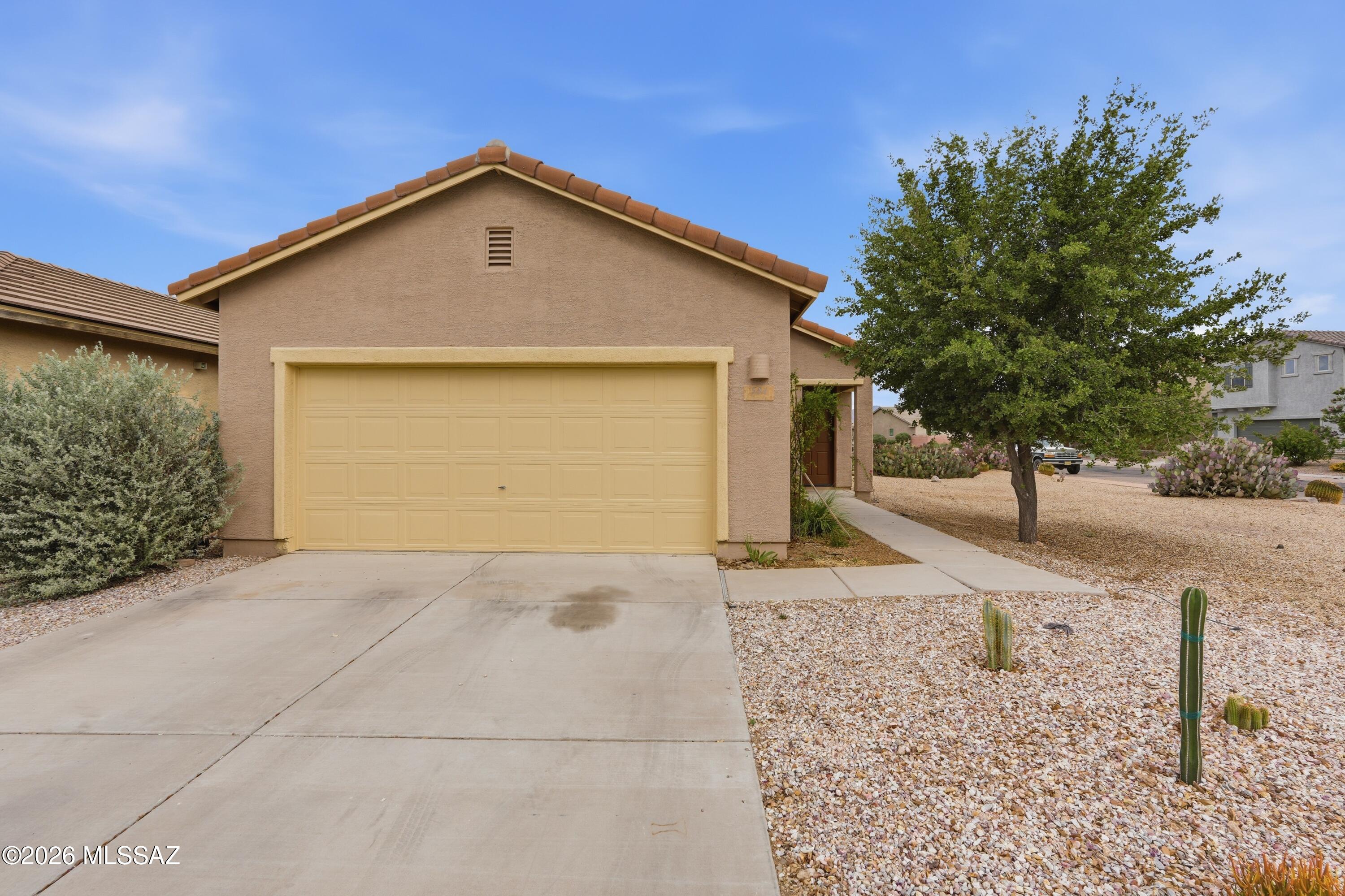No Application Fees! Single level 3-bedroom, 2-bathroom Sahuarita home located in Madera Highlands Villages offering an open floor plan and a desirable corner lot setting. Tile flooring runs through all main living and high traffic areas with neutral carpeting in the bedrooms, complemented by upgraded window blinds and ceiling fans throughout. The living space flows into the kitchen and dining area, creating a functional and connected layout with direct access to the backyard. The kitchen features extended countertop space, upgraded cabinetry, stainless steel appliances, and a dedicated dining area. The primary suite includes a walk-in closet and an attached private bathroom with a double sink vanity and tub and shower combination. Washing machine and dryer are included, and the two-car garage provides ample parking and storage. The backyard offers a covered patio, grass area, and open space, taking advantage of the corner lot positioning.

Madera Highlands Villages is located in Sahuarita near Campbell Avenue, offering access to nearby parks, walking paths, and local community amenities. The area provides a quieter residential setting with convenient access to I19 for commuting into Tucson, along with nearby shopping, dining, and everyday services within Sahuarita.
No Application Fees! 12 Month Minimum Lease. Security Deposit is equal to one month's rent.   See our criteria to rent for qualifications.

All Denali Real Estate residents are automatically enrolled in the Resident Benefits Package (RBP) for $55.00/month which includes Renter's Liability Insurance, Credit Building to help boost the resident's credit scores with timely rent payments, up to $1M Identity Theft Protection, HVAC air filter delivery (for applicable properties), our best-in-class resident rewards program, and much more!